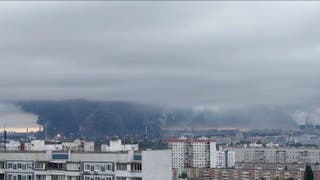 Flames and plumes ⁠of smoke rise over the south-eastern district of Kapotnya after major oil refinery attacked