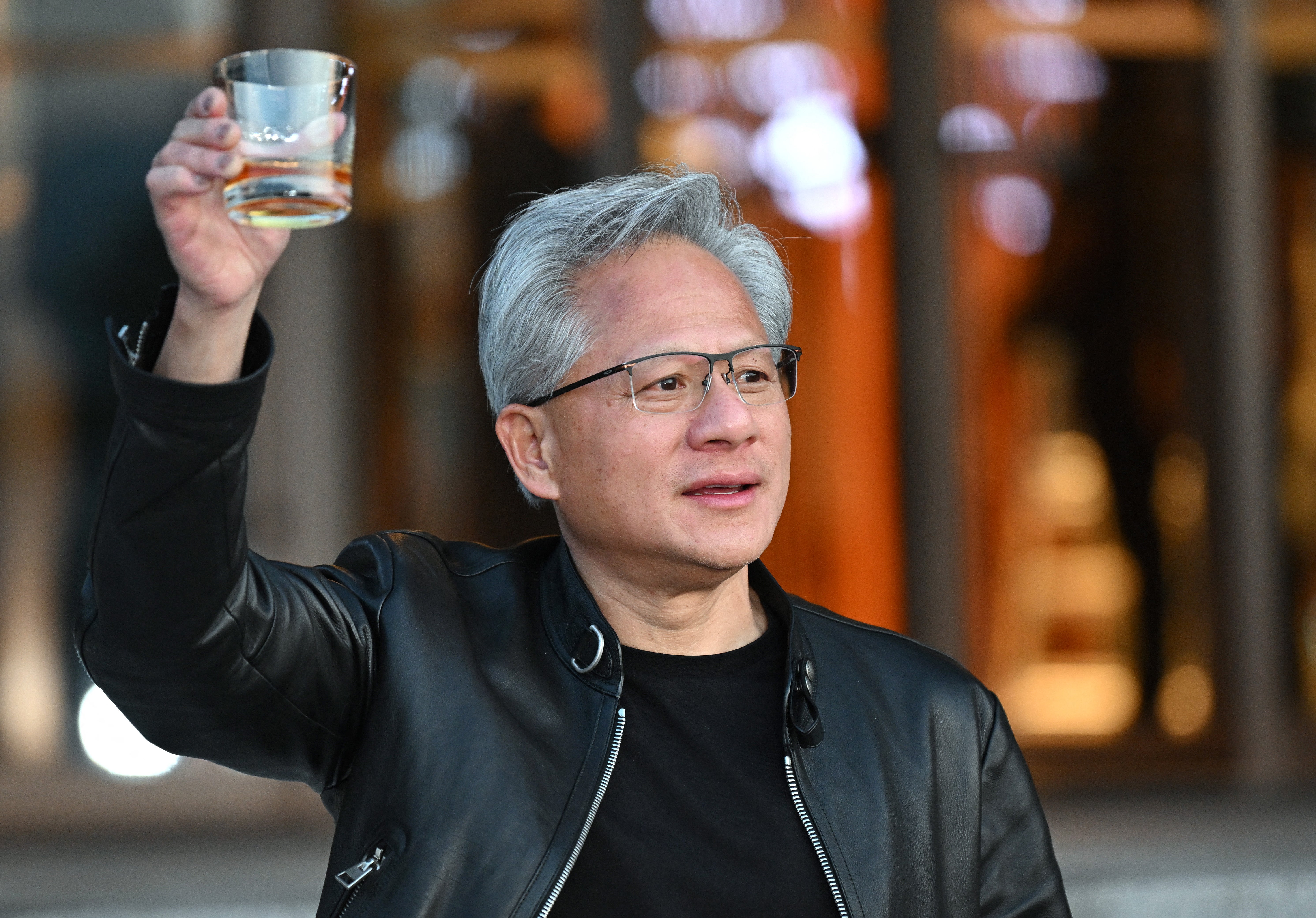 Nvidia CEO Jensen Huang reacts as he speaks to reporters after a meeting with Korean AI and robotics startup executives at a hotel in Seoul on June 8