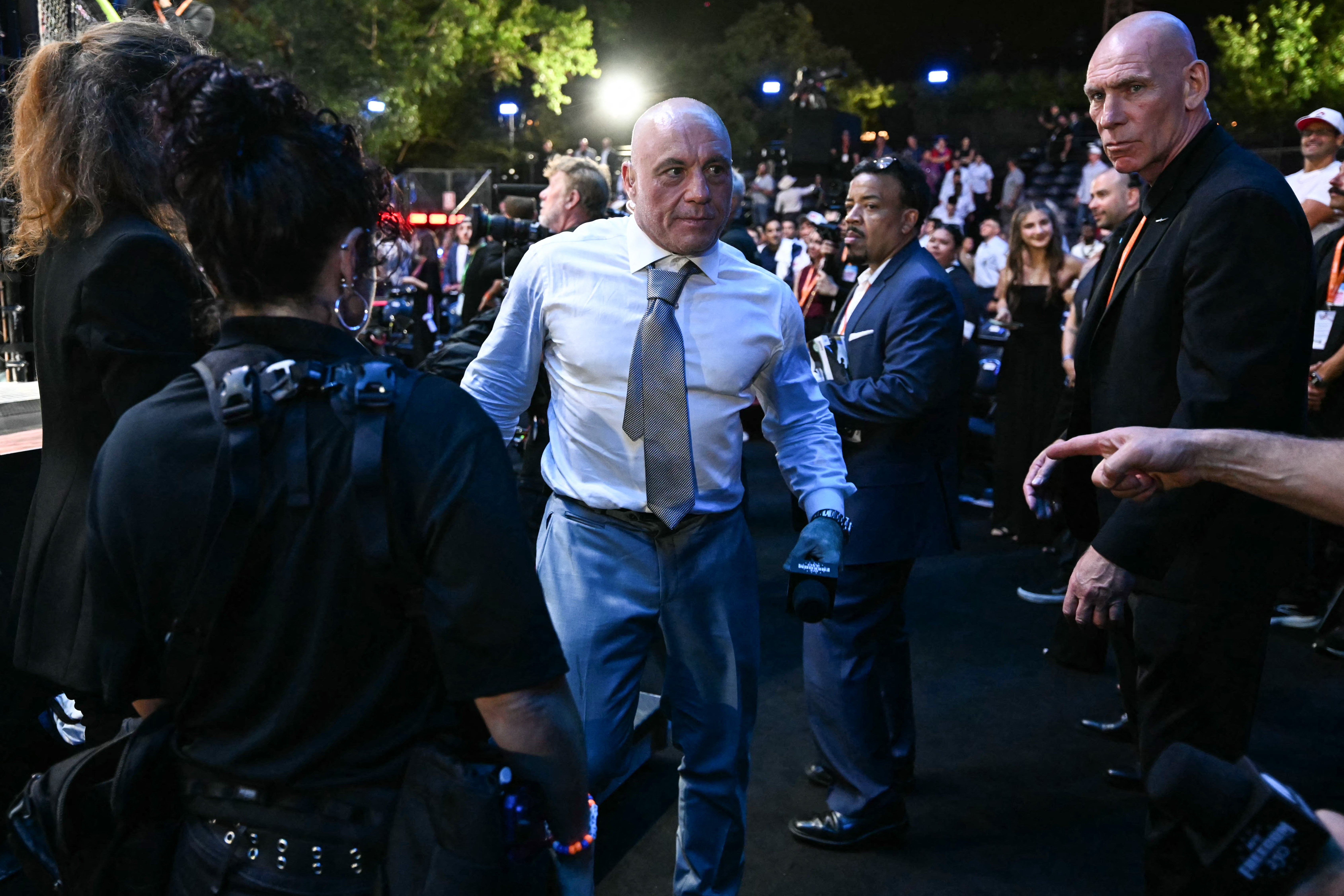 Rogan endorsed Trump in the 2024 election, but since then has criticized several of his major policy initiatives, including his immigration crackdown. Pictured here, the comedian attends Trump's UFC Freedom 250 event at the White House on June 15