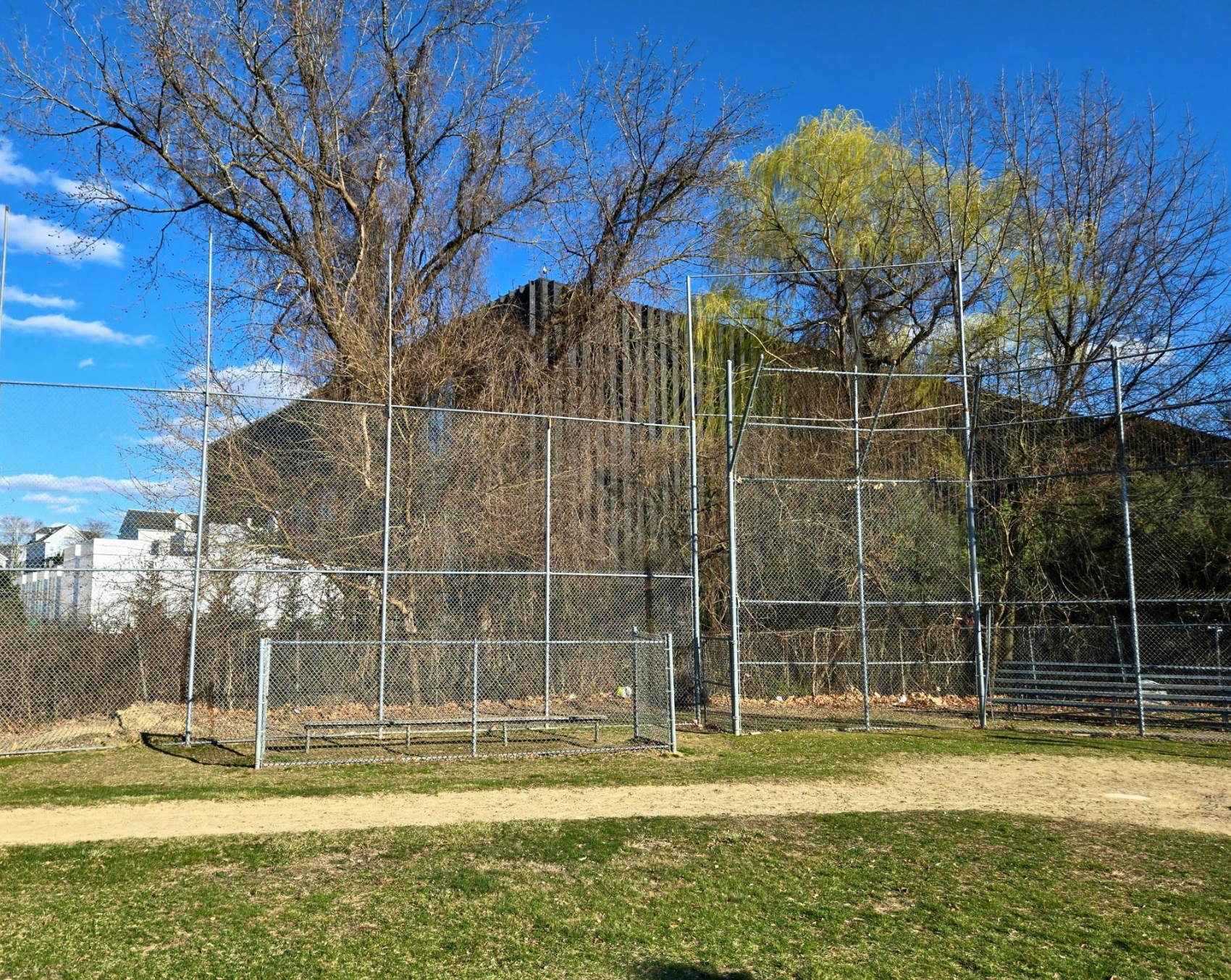 A data center in Lowell, Massachusetts looms over a nearby youth baseball field