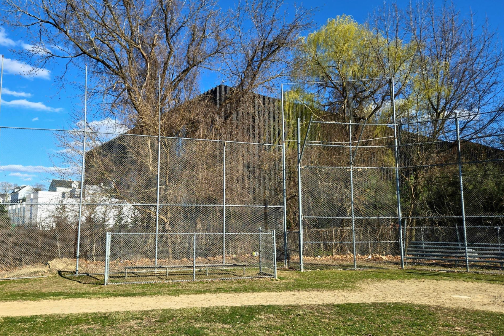 A data center in Lowell, Massachusetts looms over a nearby youth baseball field (Yale Environmental Justice Law and Advocacy Clinic)
