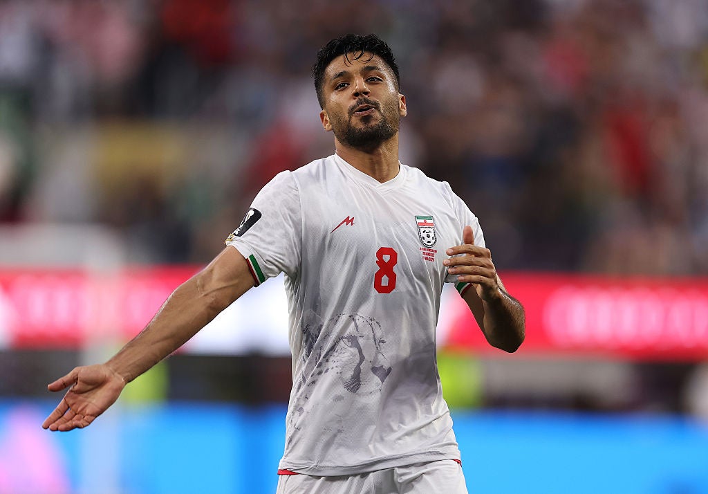 The most striking imagery on Iran's home (white) and away (red) kits is an Asiatic cheetah low across the front