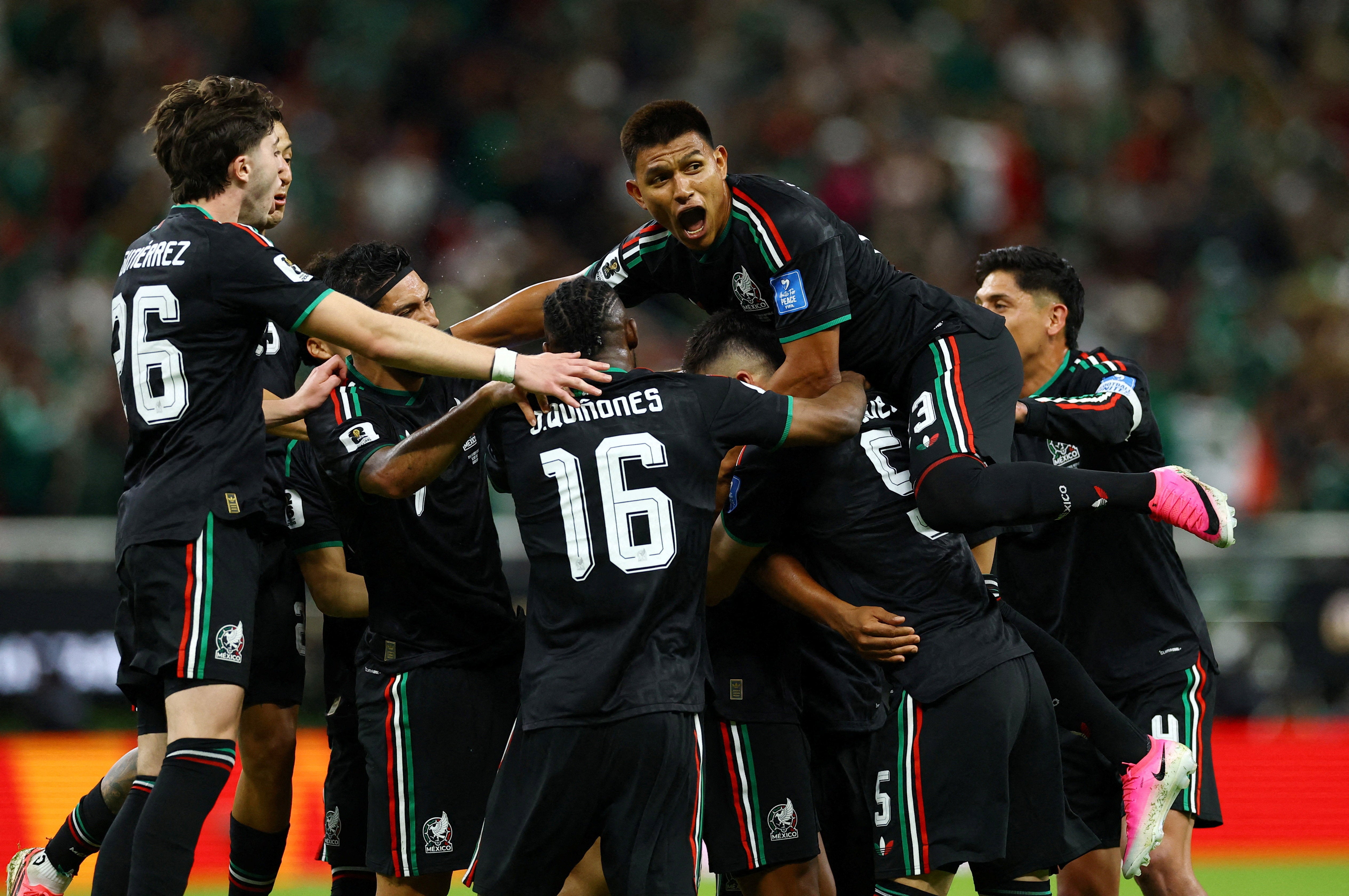 Mexico's Luis Romo celebrates scoring their first goal against South Korea with teammates