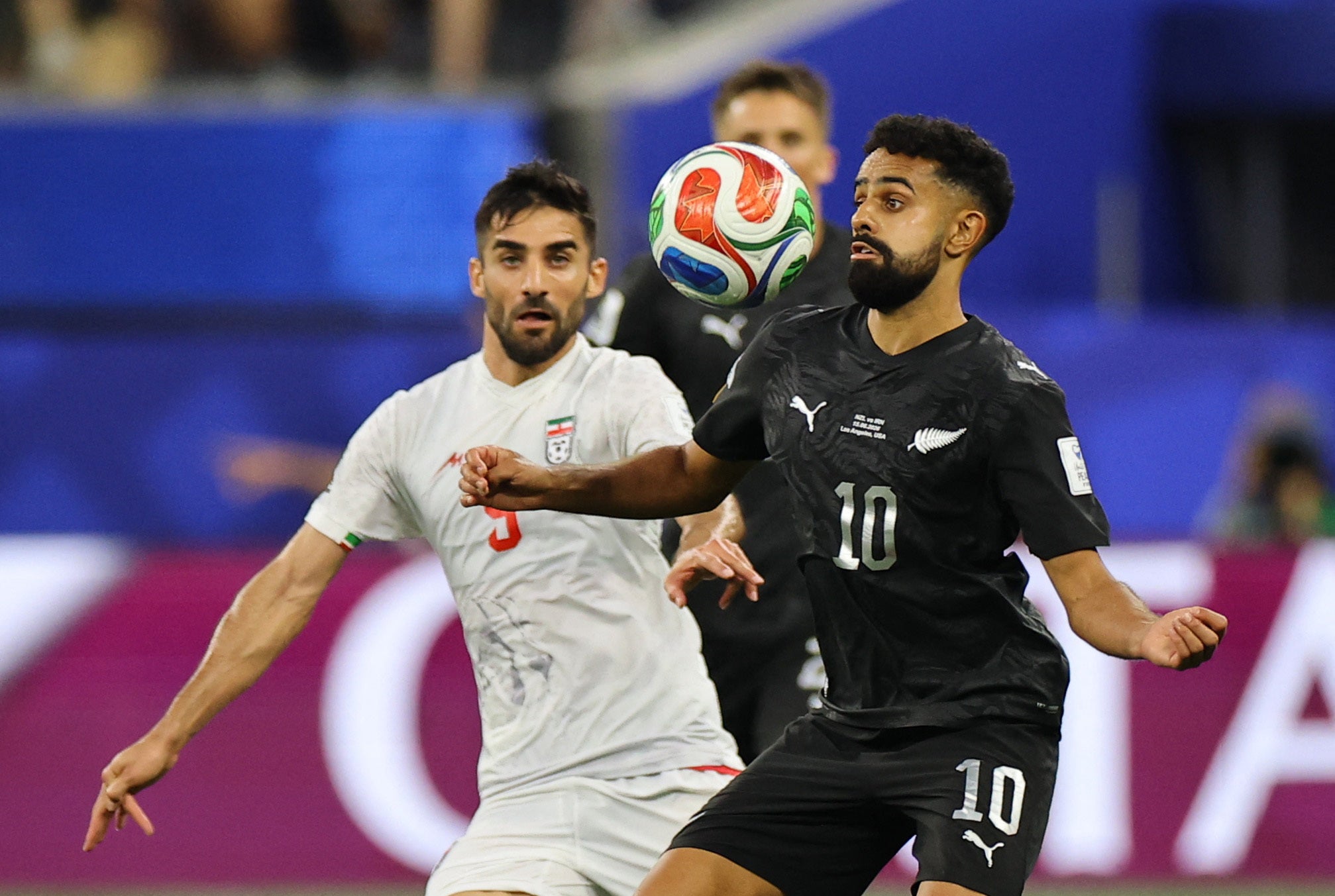 Sarpreet Singh, right, in action with Iran's Milad Mohammadi