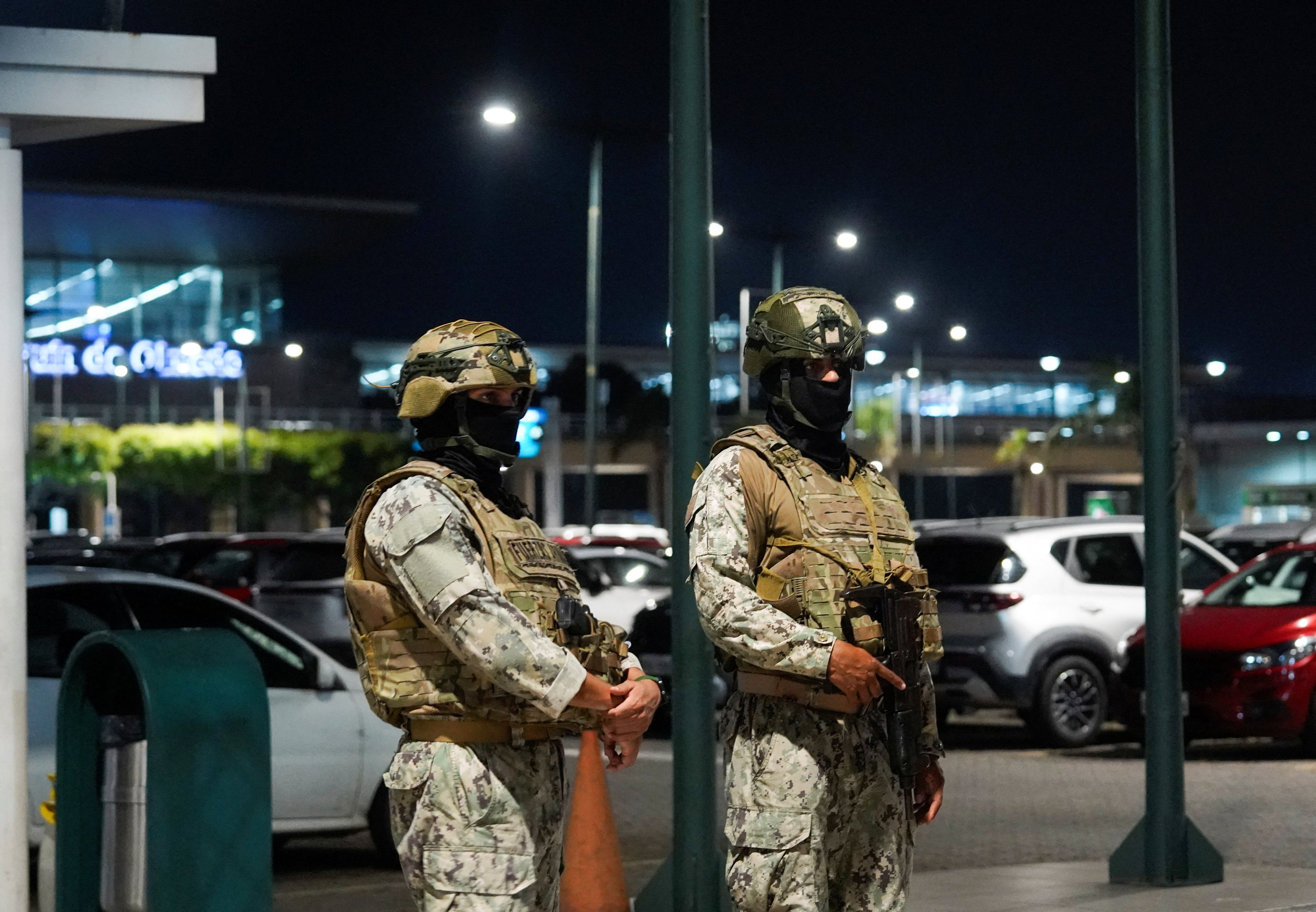 Members of Ecuador's Armed Forces stand near the site of an armed attack at Jose Joaquin de Olmedo International Airport, where authorities said at least one person was killed and another injured, in Guayaquil, Ecuador, June 17, 2026.