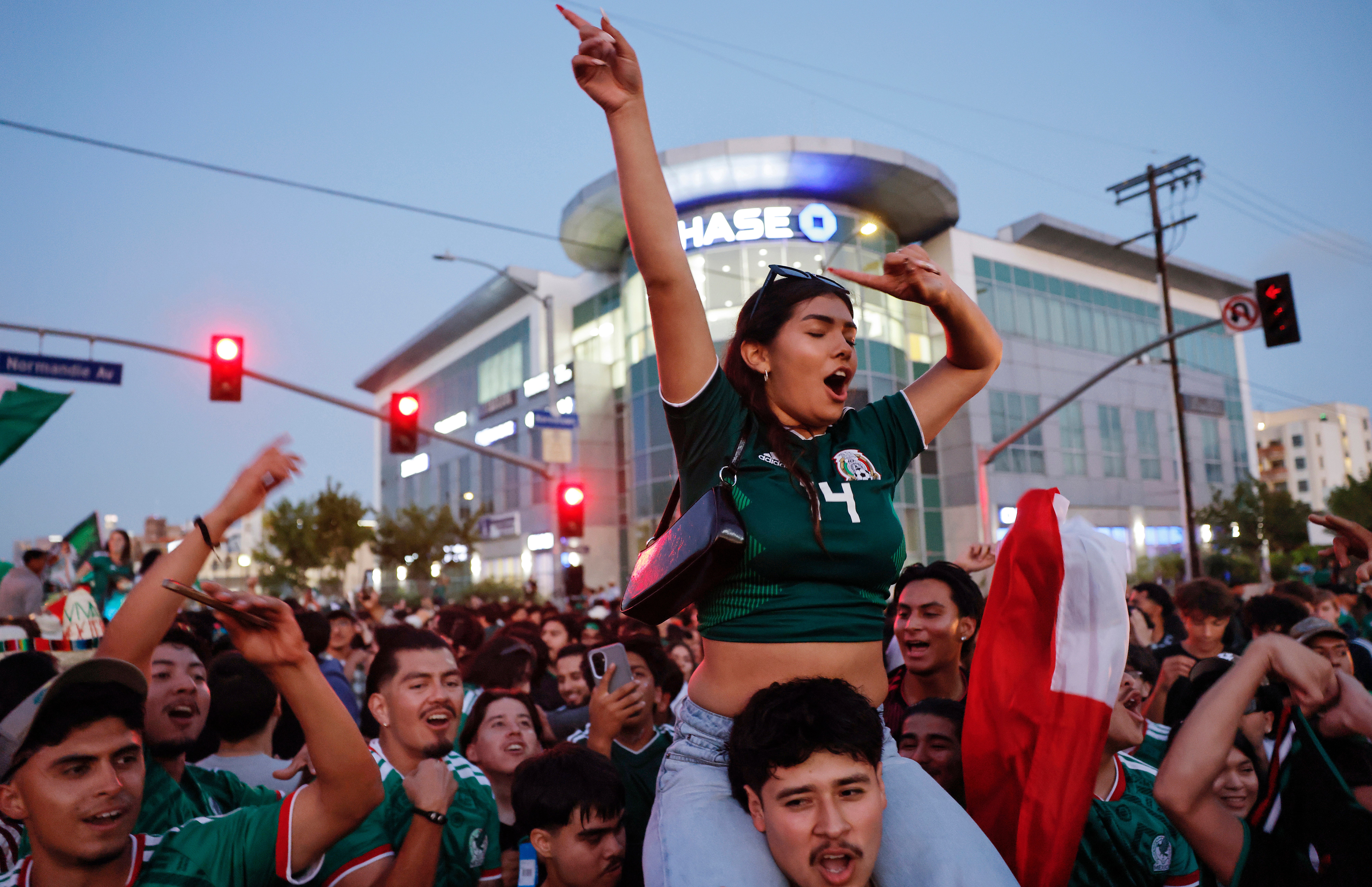 Mexico fans celebrate after Mexico won 1-0 over South Korea, after a watch party in Koreatown which is home to large Korean and Mexican communities