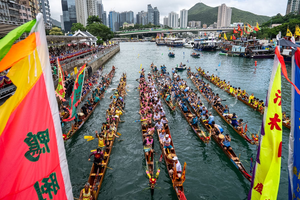 Competitors take part in boat races to mark the Dragon Boat Festival, in photos