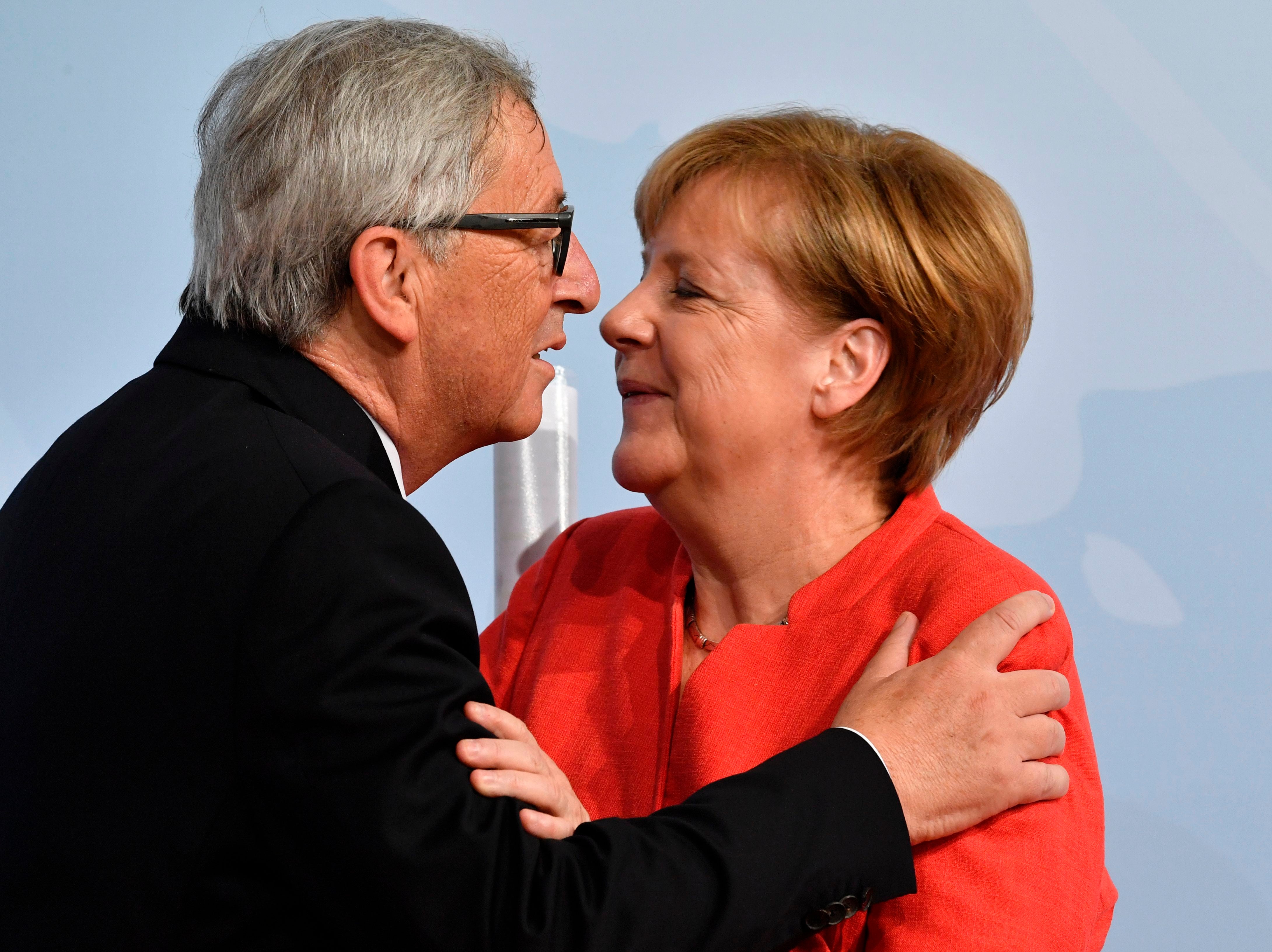 German chancellor Angela Merkel greets the president of the European Commission Jean-Claude Juncker (AFP/Getty)