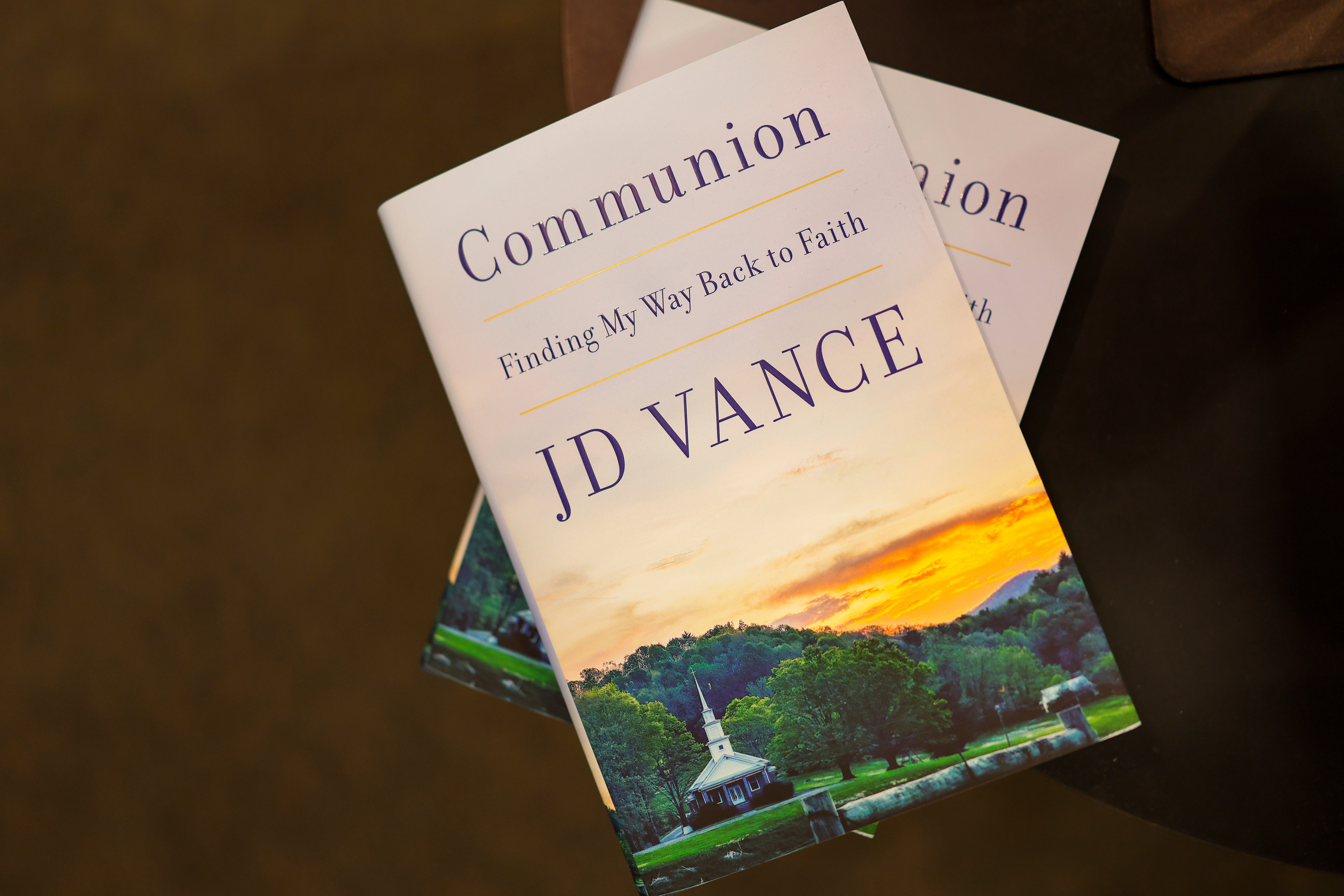 The book is a memoir of Vance’s spiritual journey from Protestant to atheist to Catholic