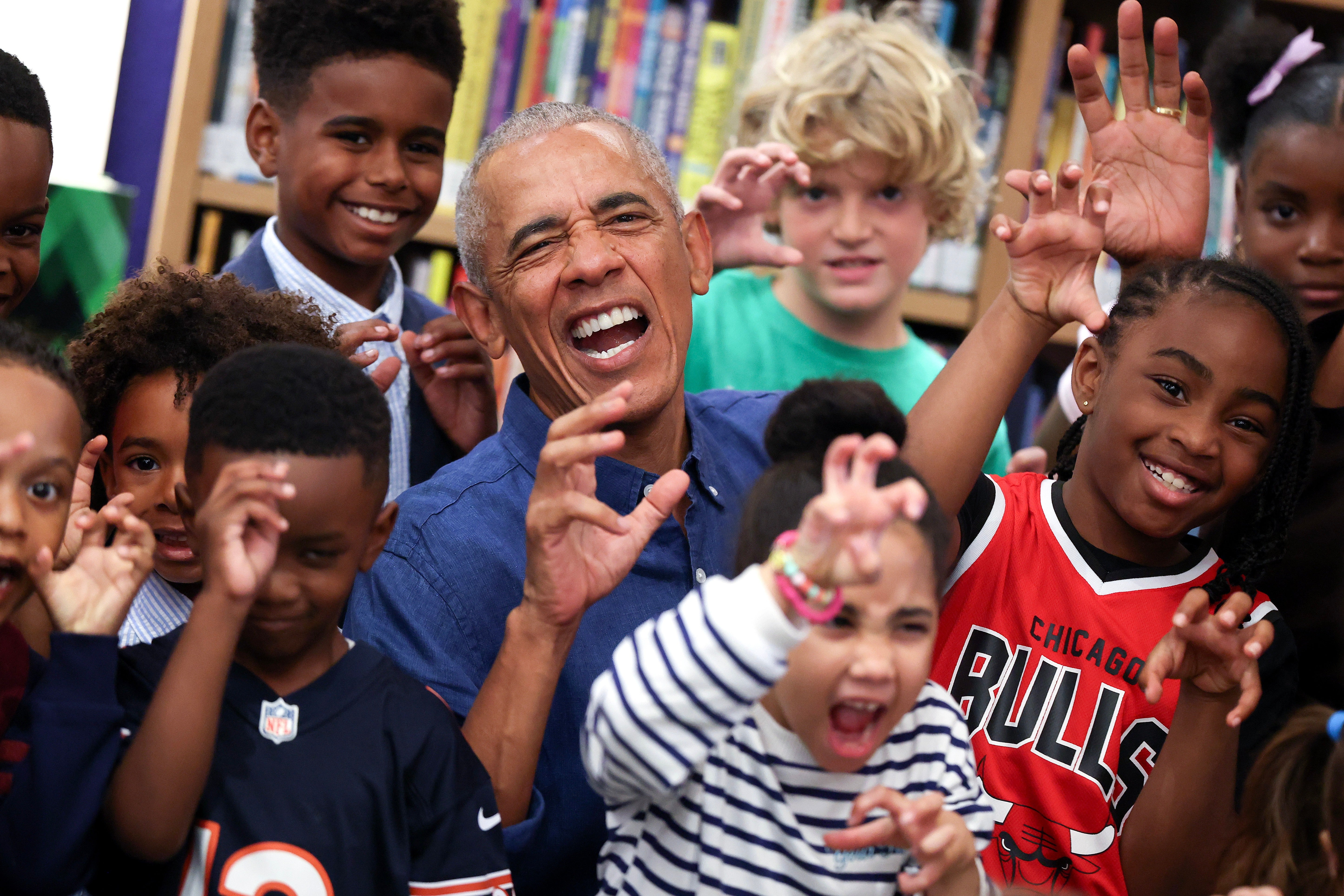 The Obamas delighted 25 schoolchildren at the center's Chicago Public Library branch by reading Maurice Sendak's classic ‘Where the Wild Things Are’