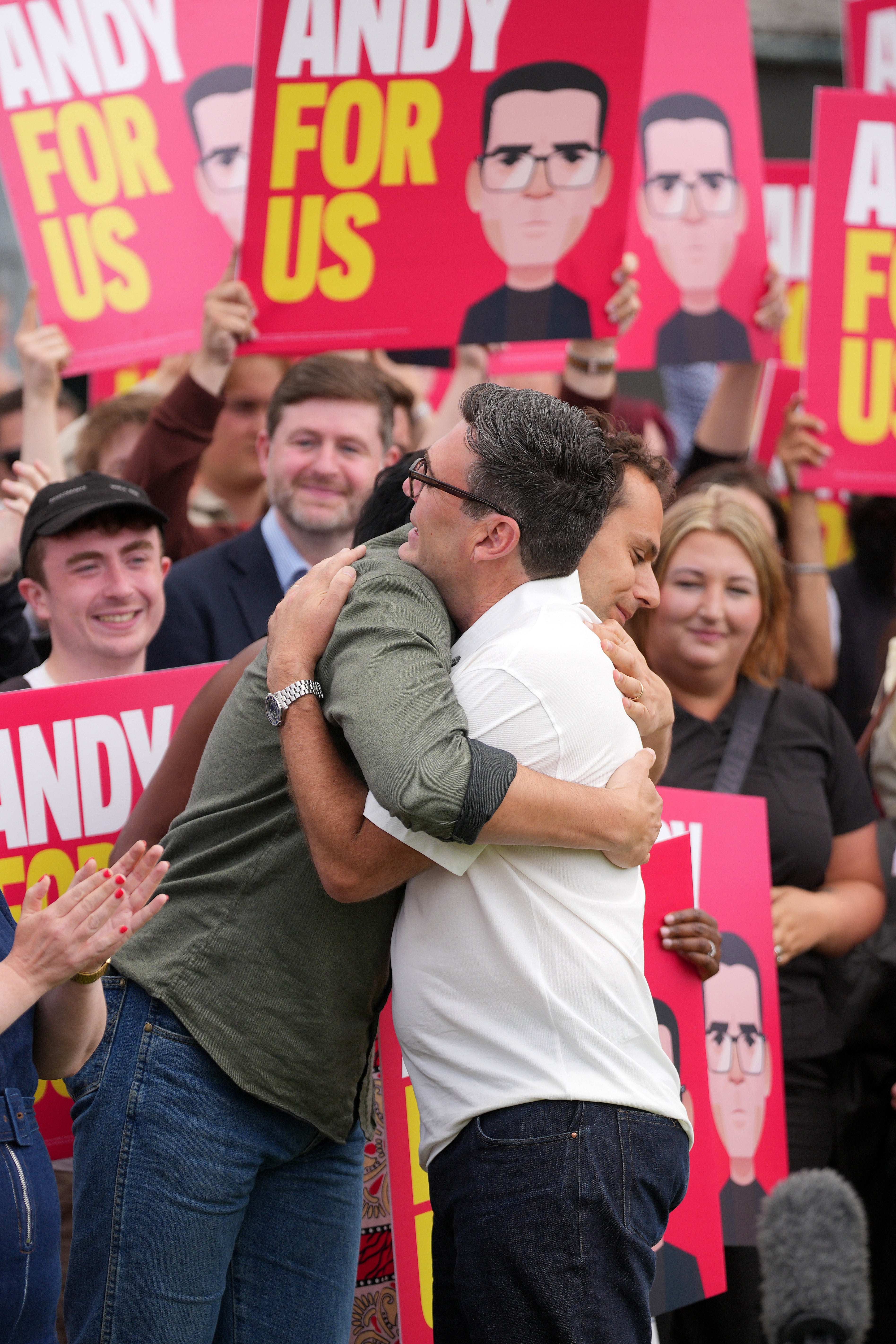 Former Labour MP for Makerfield, Josh Simons embraces Andy Burnham (R) as he celebrates his victory in yesterday's Makerfield by-election, at Ashton Town Football Club, on June 19, 2026 in Ashton in Makerfield, England.
