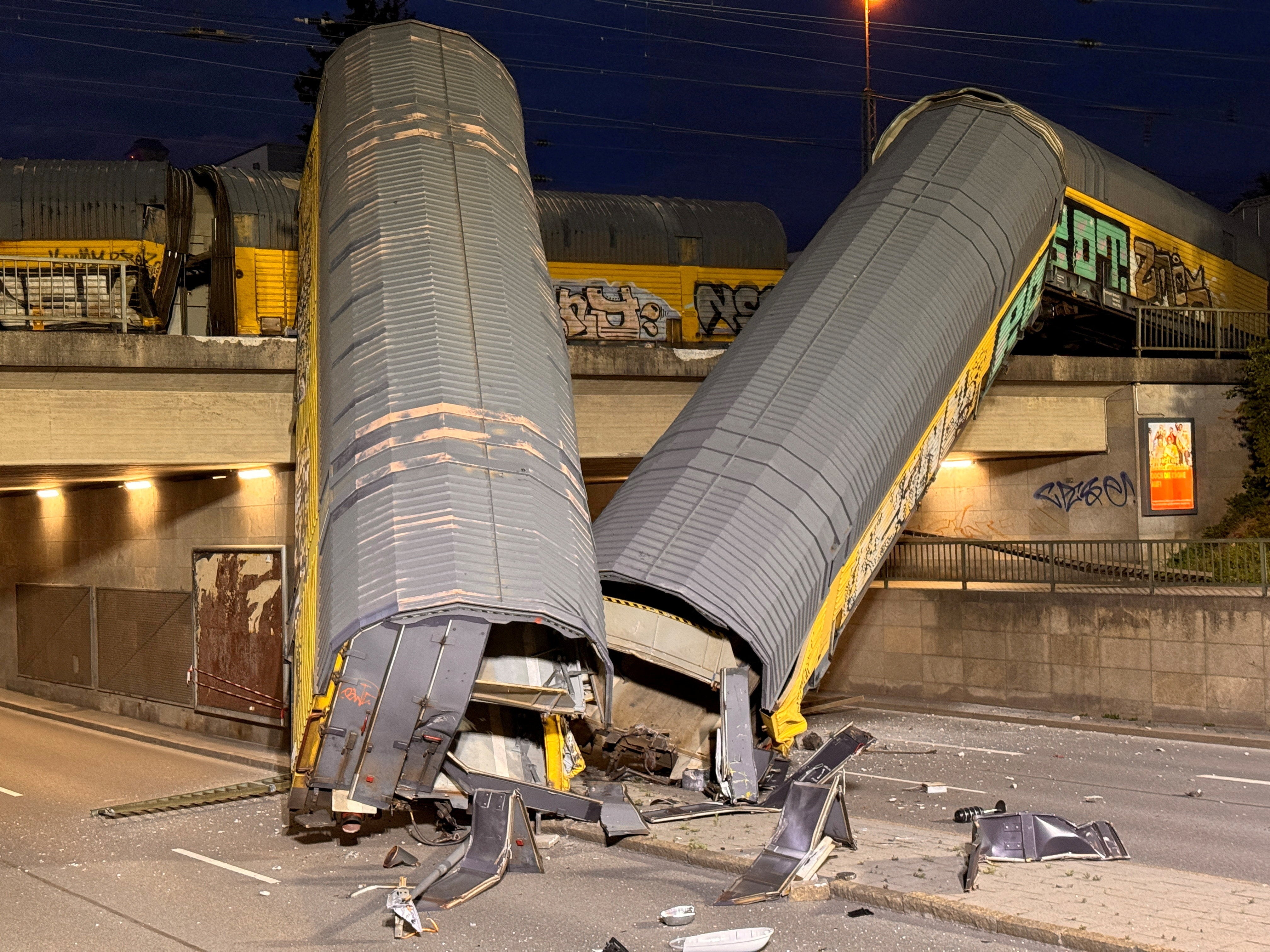 Person dies after trains collide on Munich bridge, sending carriages tumbling to street below