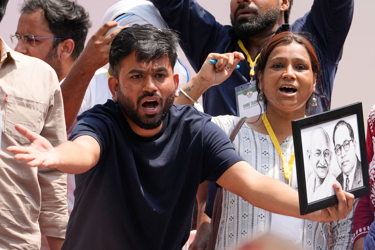 India's Cockroach Party supporters bang plates to call for education minister's resignation