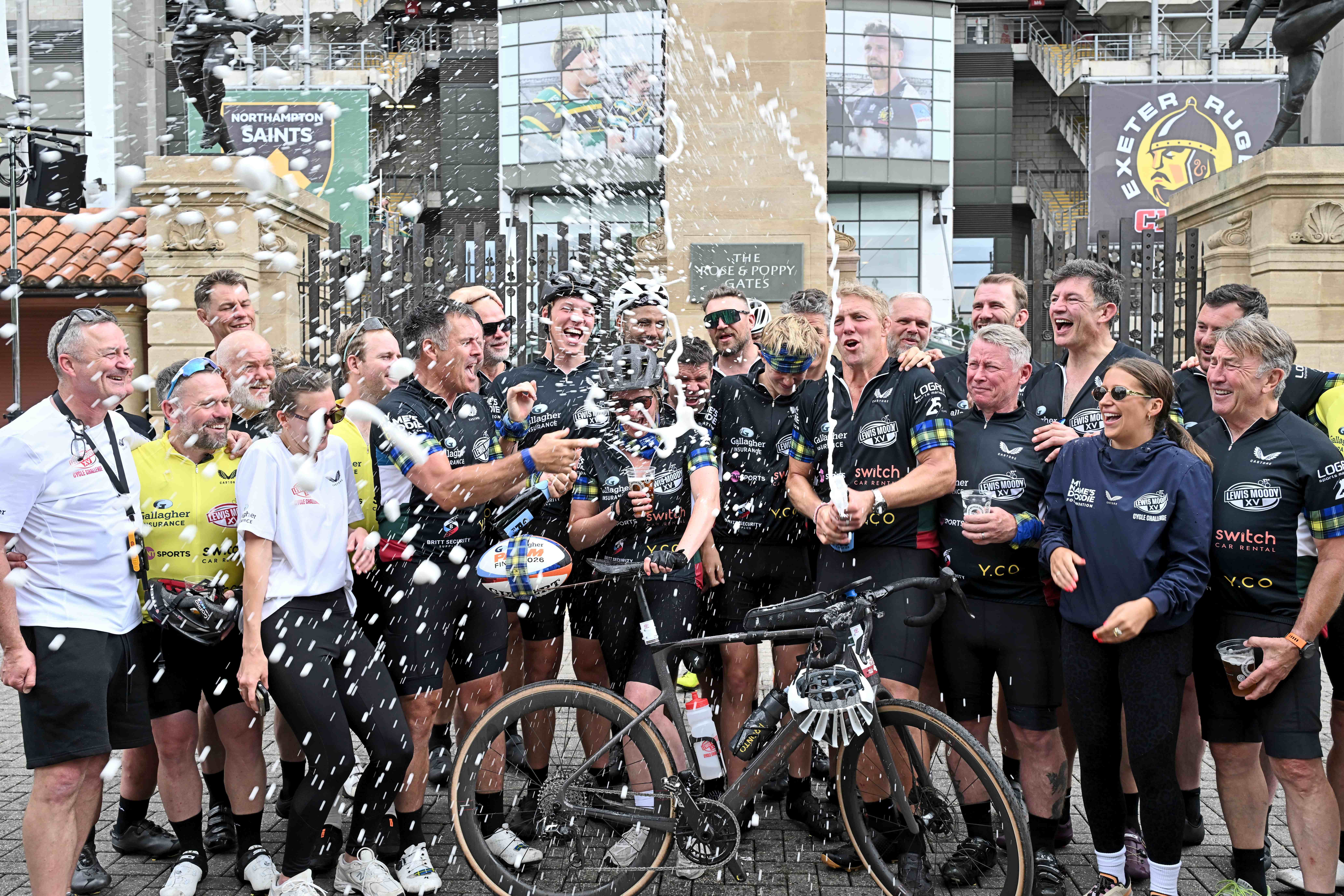 Lewis Moody and his fellow riders celebrate arriving at Twickenham after a 500-mile cycling challenge