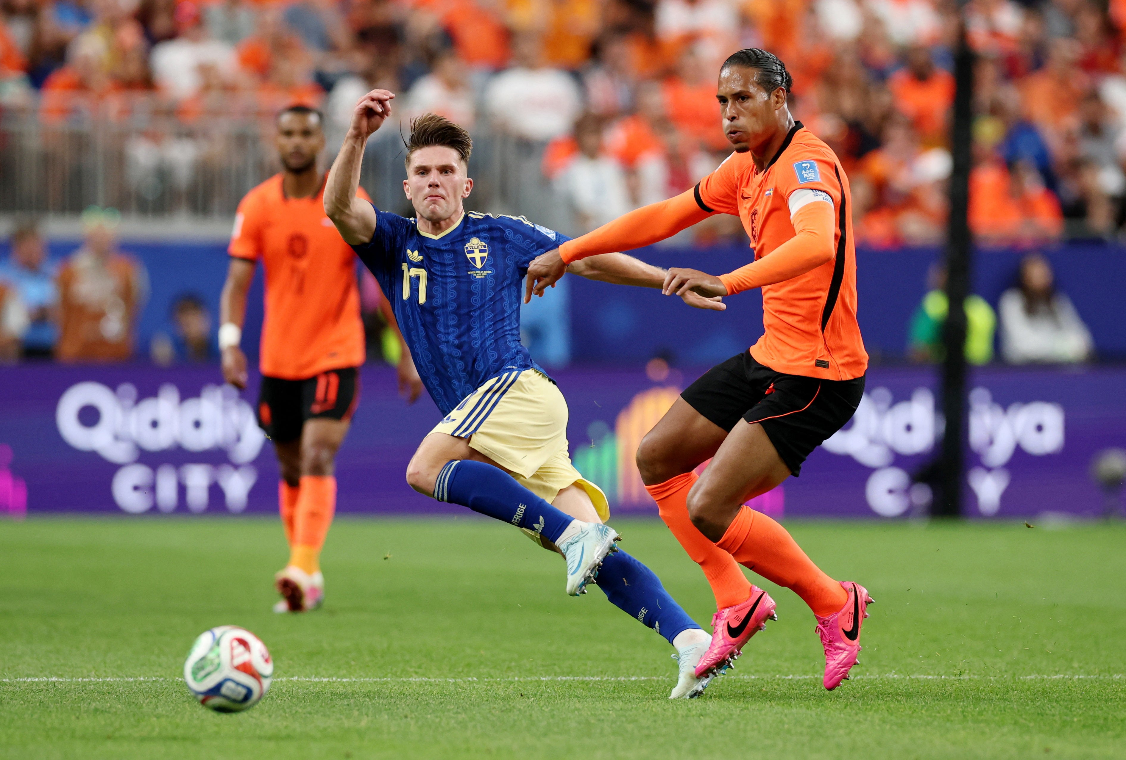 Viktor Gyokeres is challenged by Virgil van Dijk