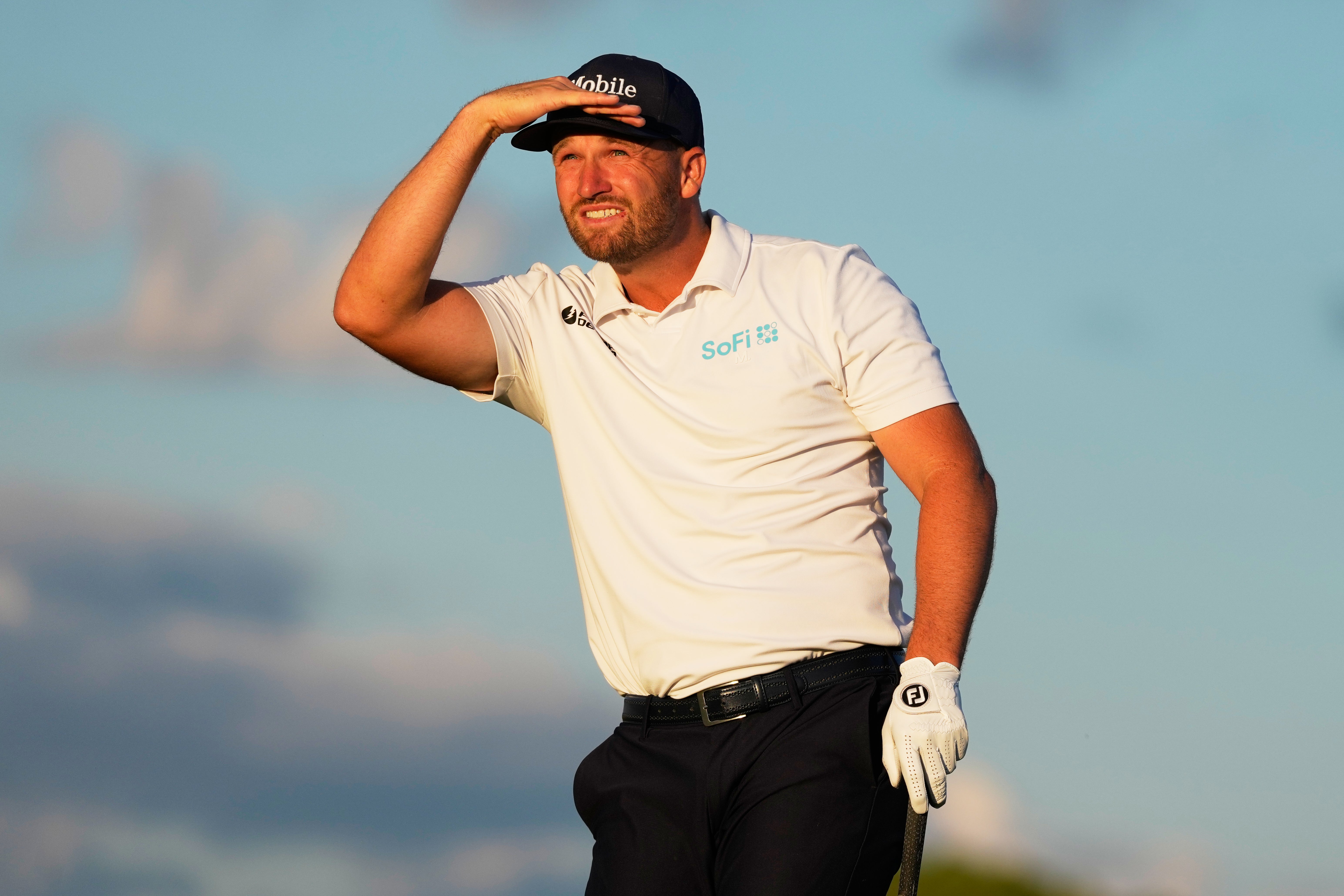 Wyndham Clark watches his tee shot on the 17th (David J Phillip/AP)