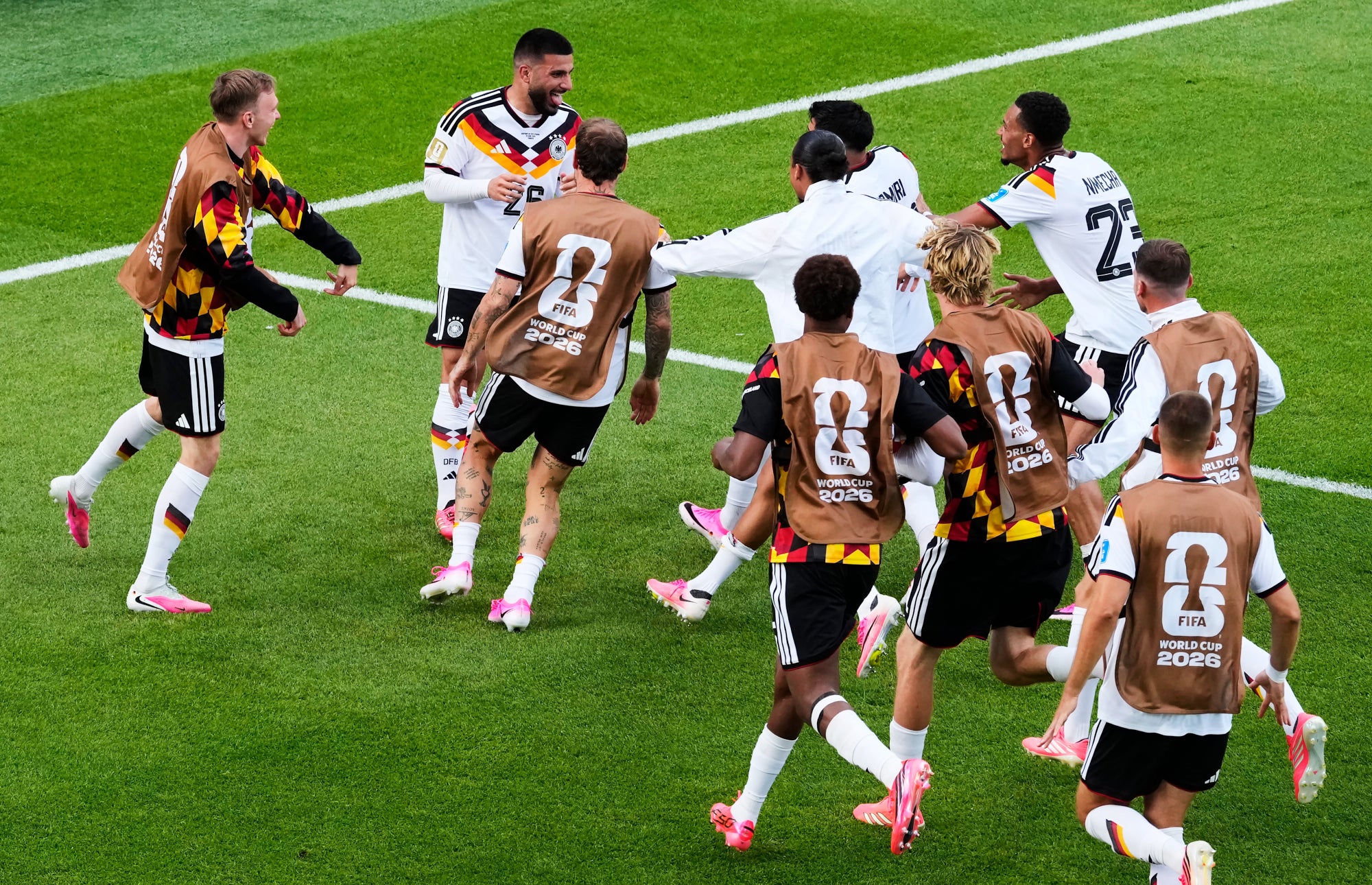 Germany's Deniz Undav (26) is mobbed by teammates