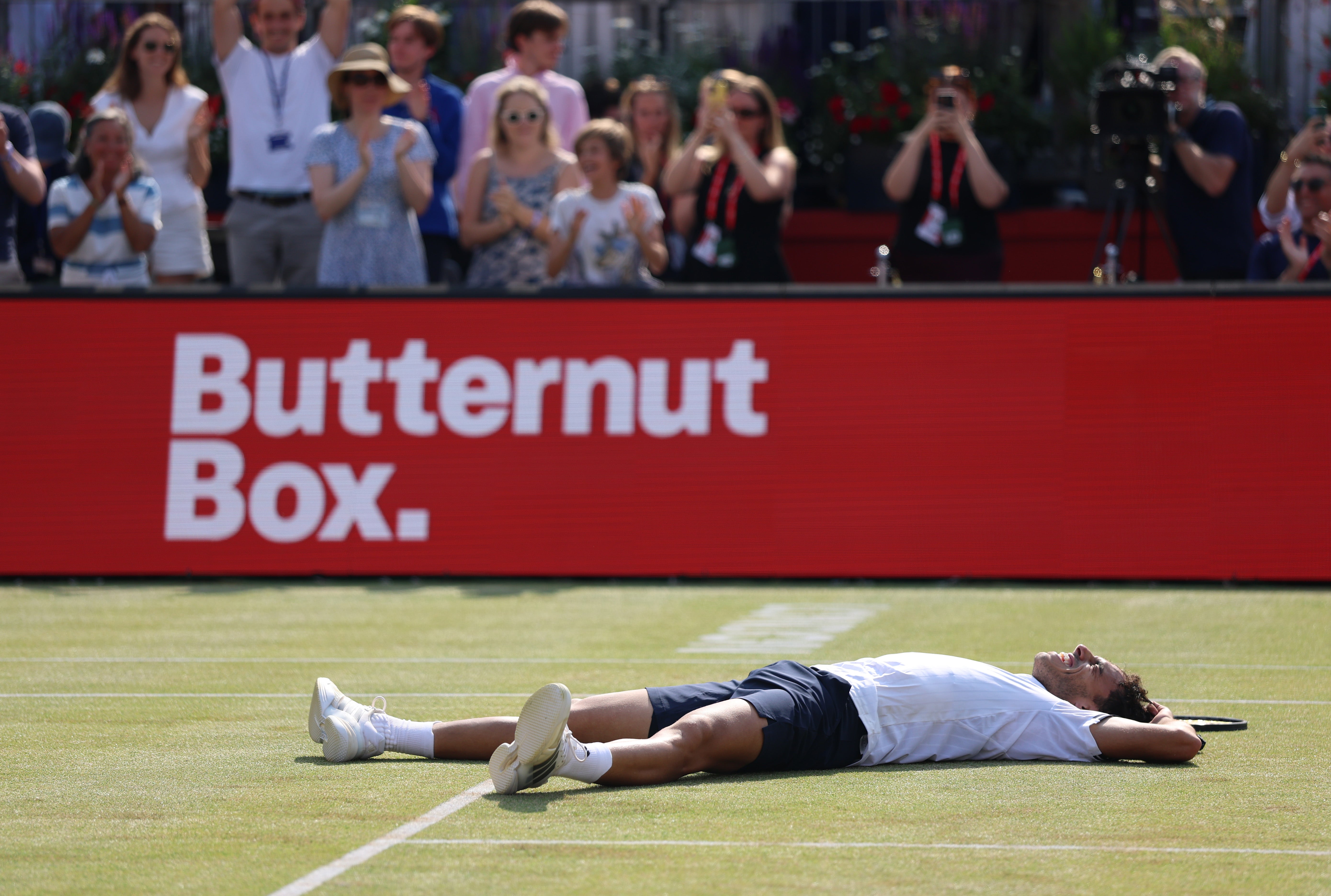 Cerundolo dropped to the ground in delight and exhaustion as he converted his fifth championship point
