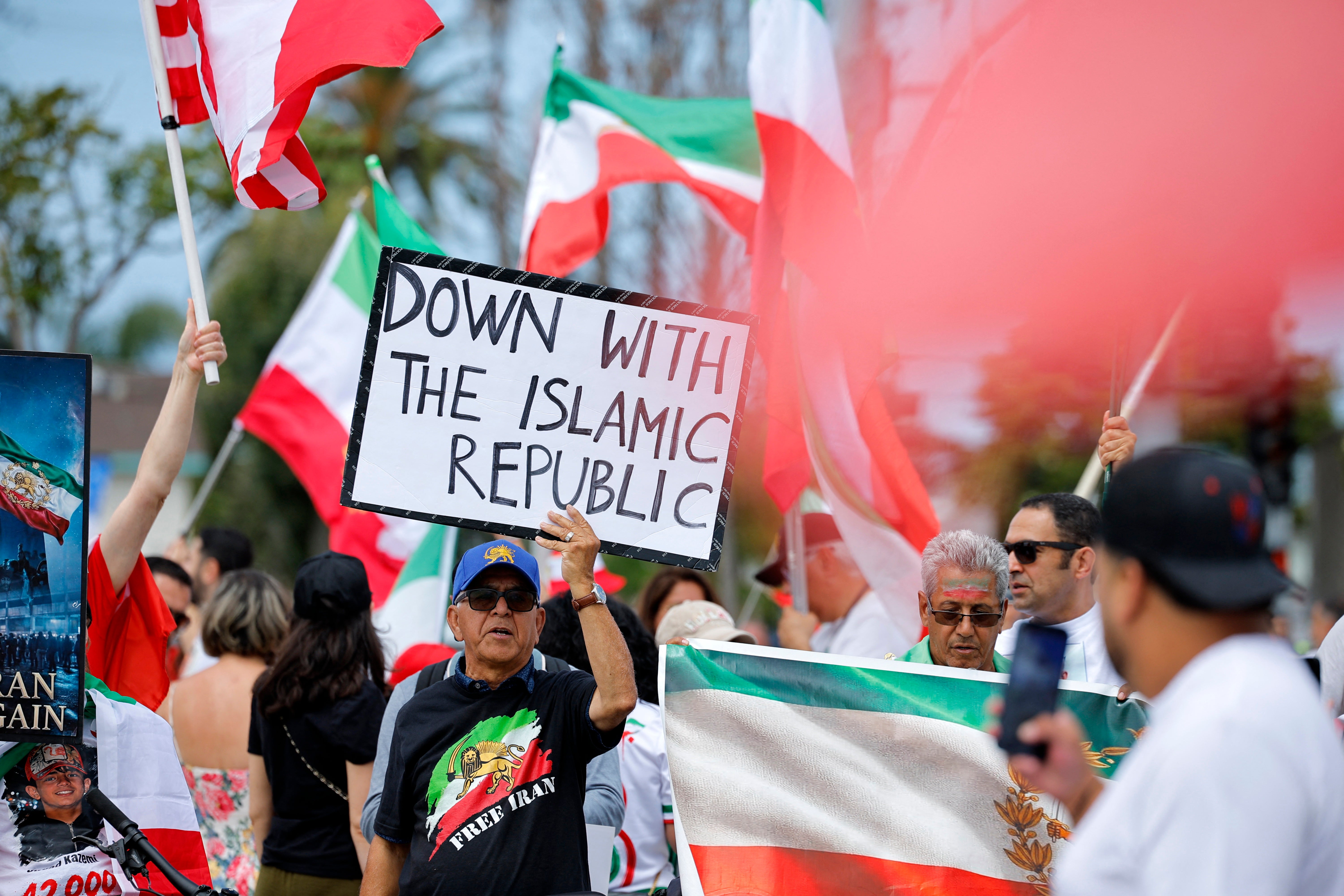 Iranian-Americans protest outside the stadium before the match