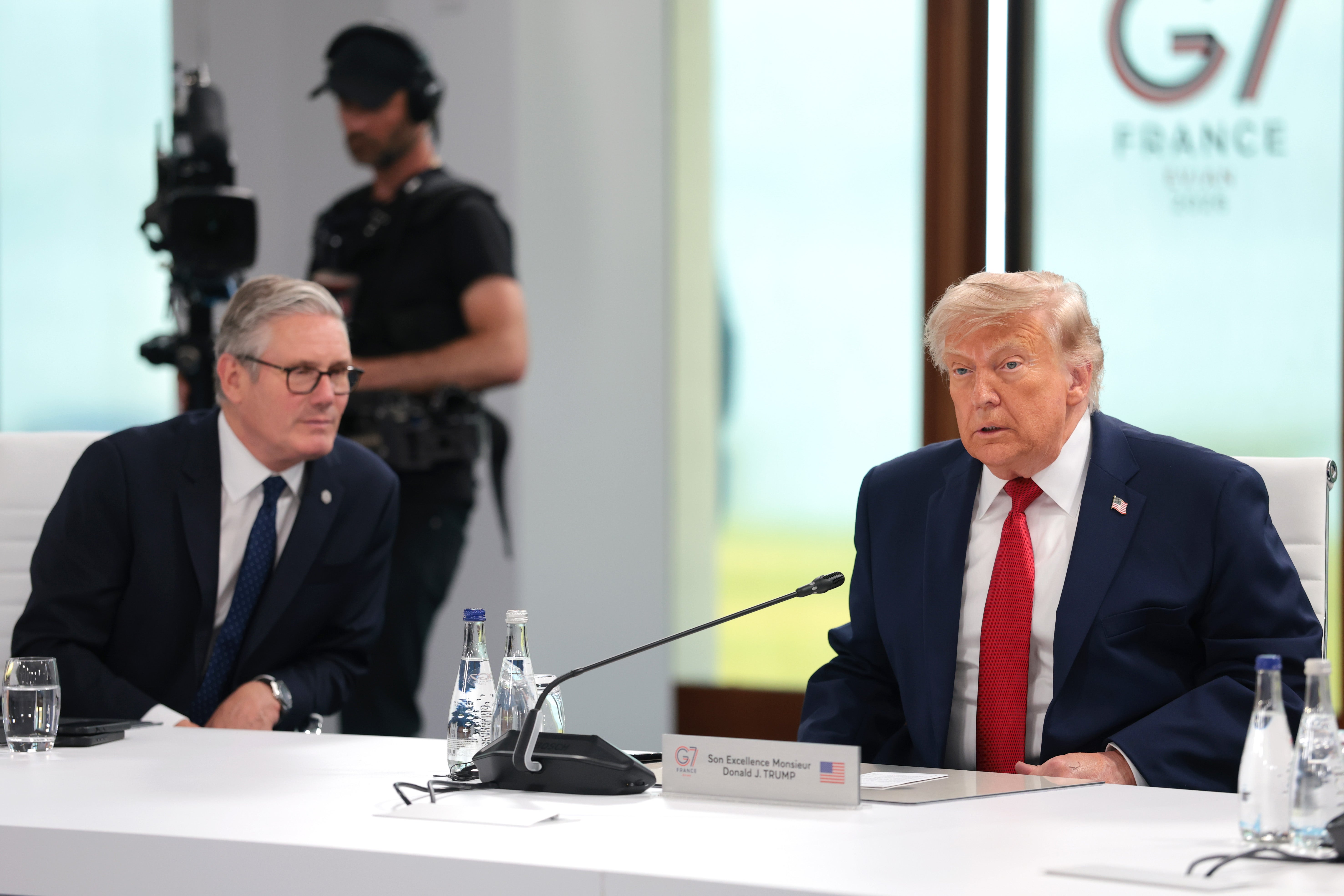 U.S. President Donald Trump (R) sits alongside British Prime Minister Keir Starmer during a working session on promoting economic growth with G7 leaders and G7 outreach partners, during the G7 Summit on June 17, 2026 in Evian-les-Bains, France.