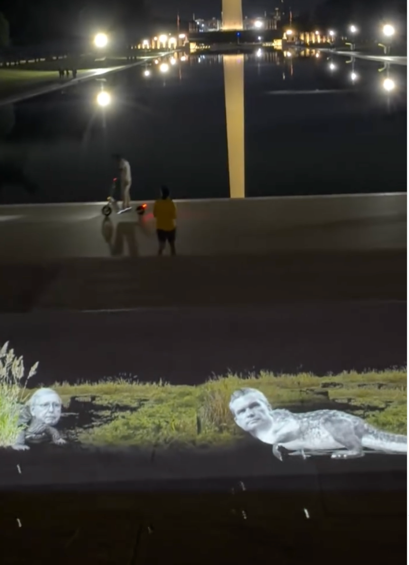 Projections across Washington DC from prankster group VJayBombs portrayed Senator Mitch McConnell and Defense Secretary Pete Hegseth as swamp creatures near the Lincoln Memorial Reflecting Pool