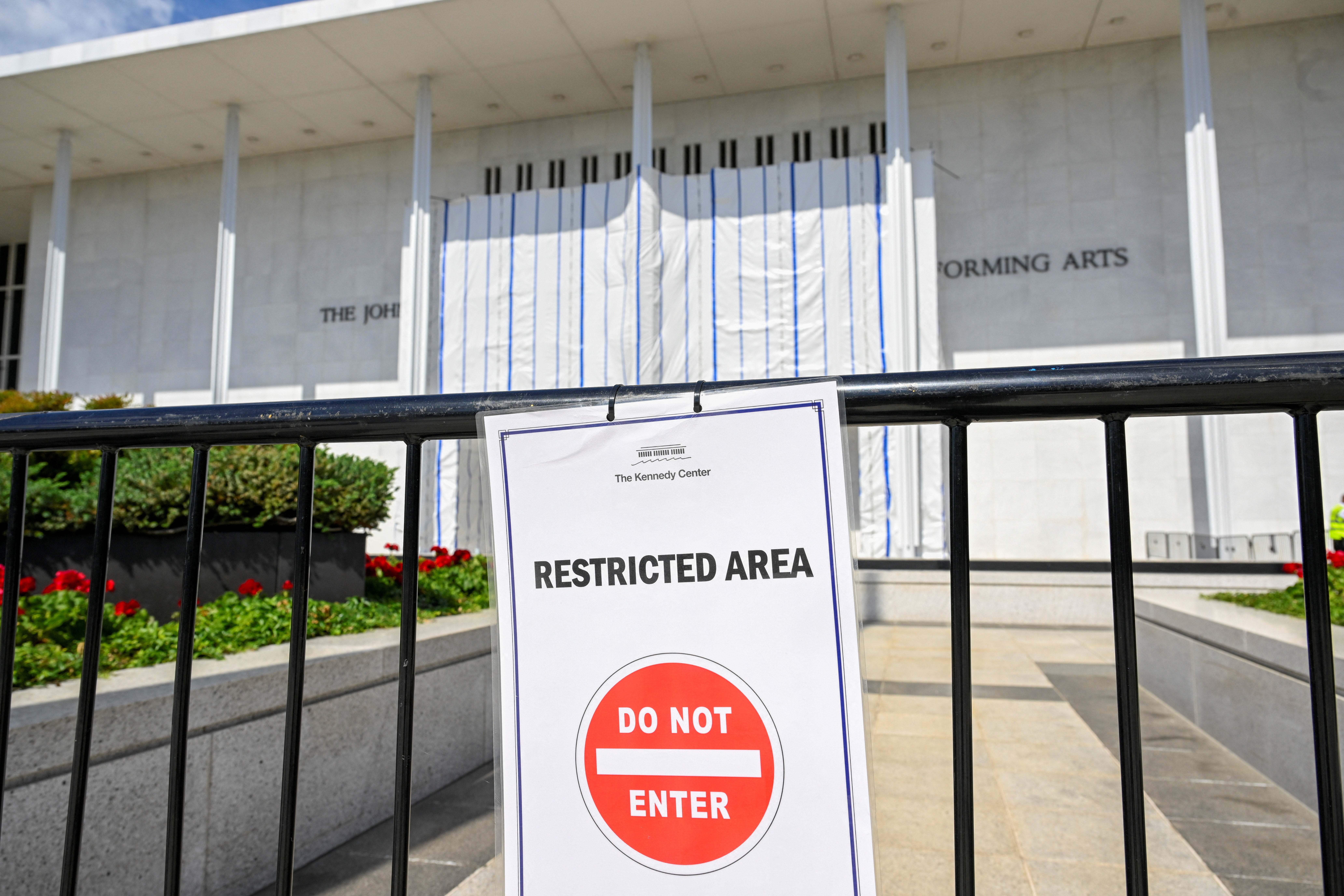 Pranksters used the tarp-covered Kennedy Center entrance to project images of Donald Trump and Jeffrey Epstein as similar projections popped up across Washington DC