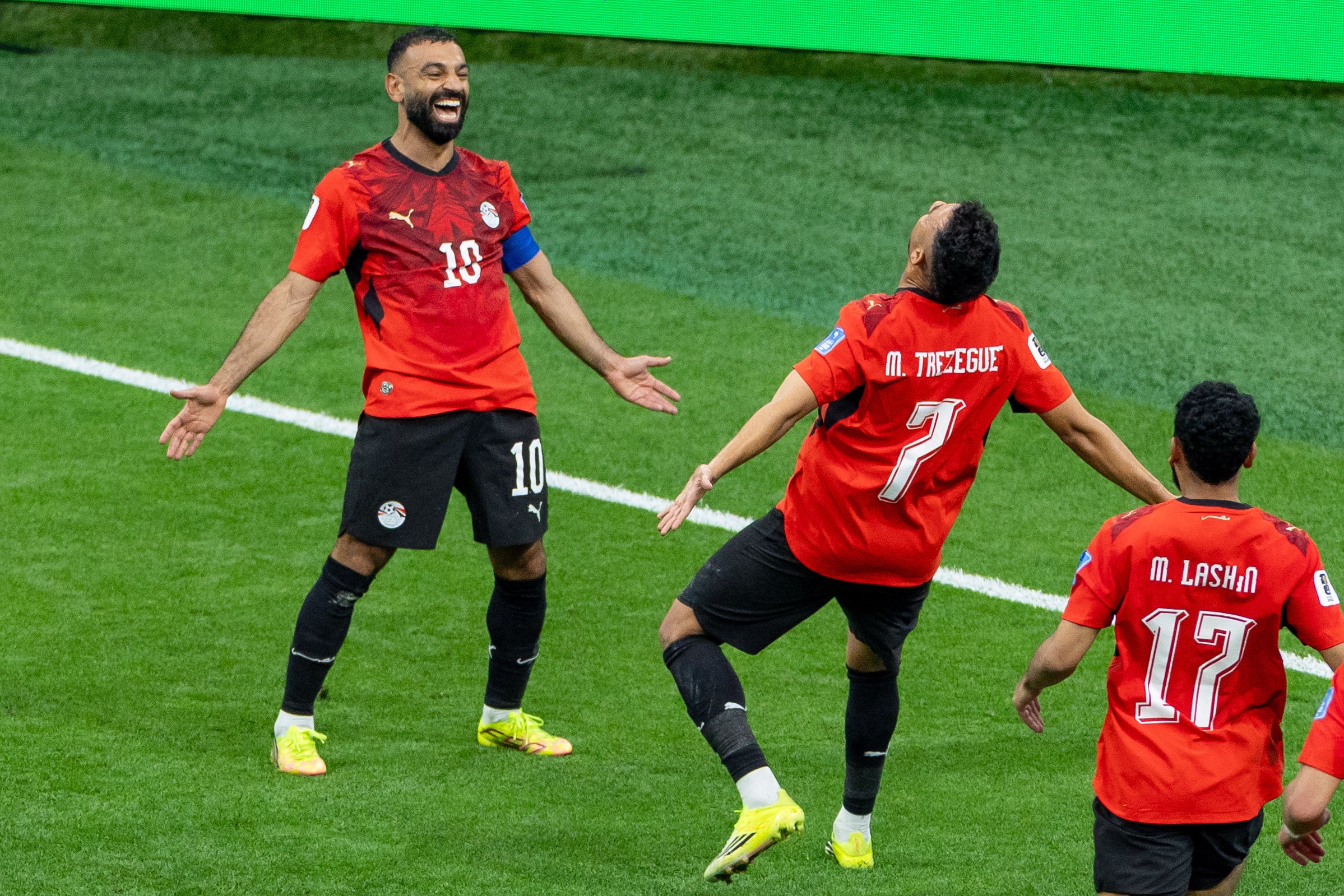 Egypt’s Trezeguet (7) celebrates his goal against New Zealand with teammate Mohamed Salah (10) during the World Cup Group G soccer match between New Zealand and Egypt