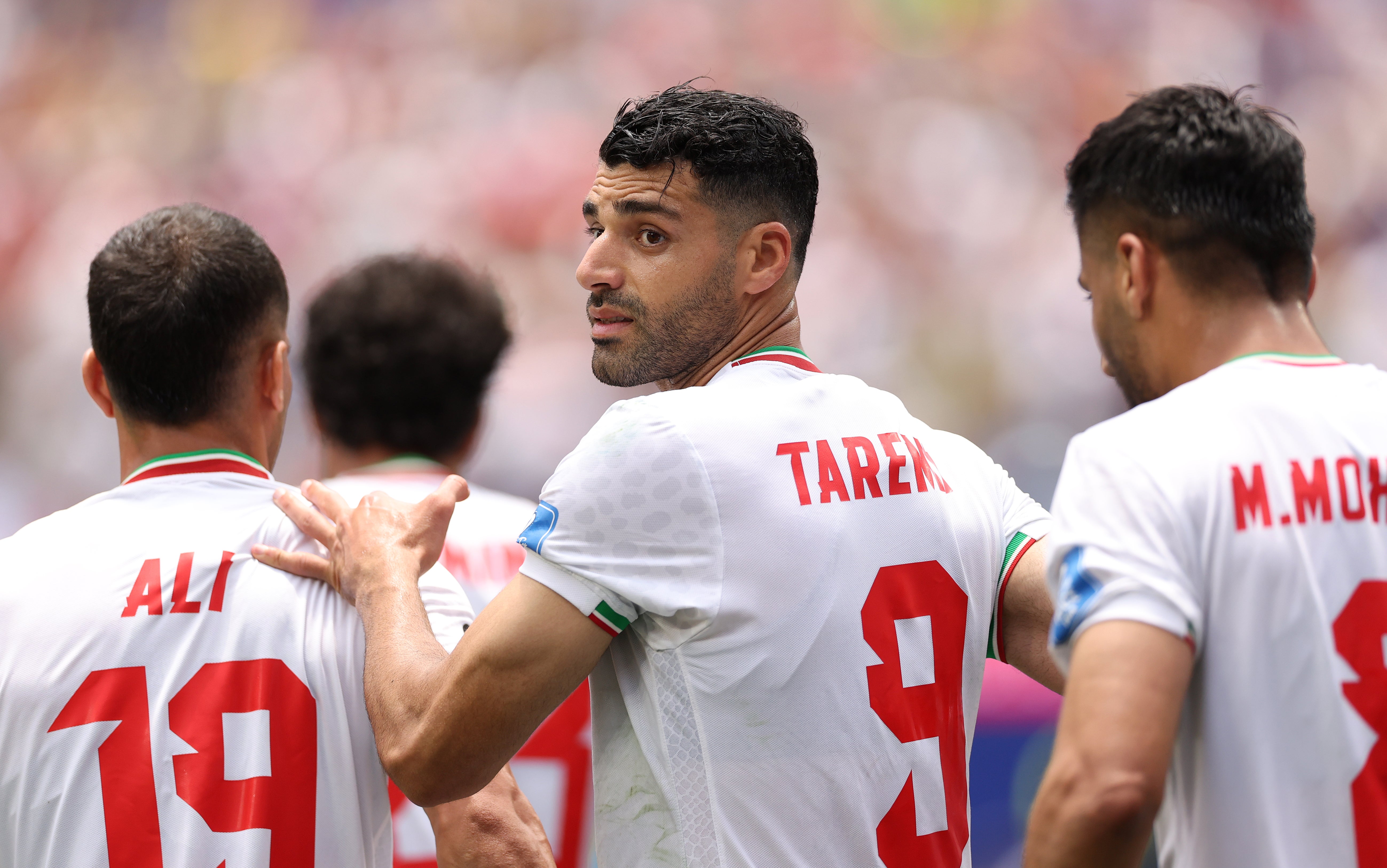 Mehdi Taremi #9 of IR Iran celebrates with team mates after scoring, only to have the goal disallowed, on Sunday (Getty)