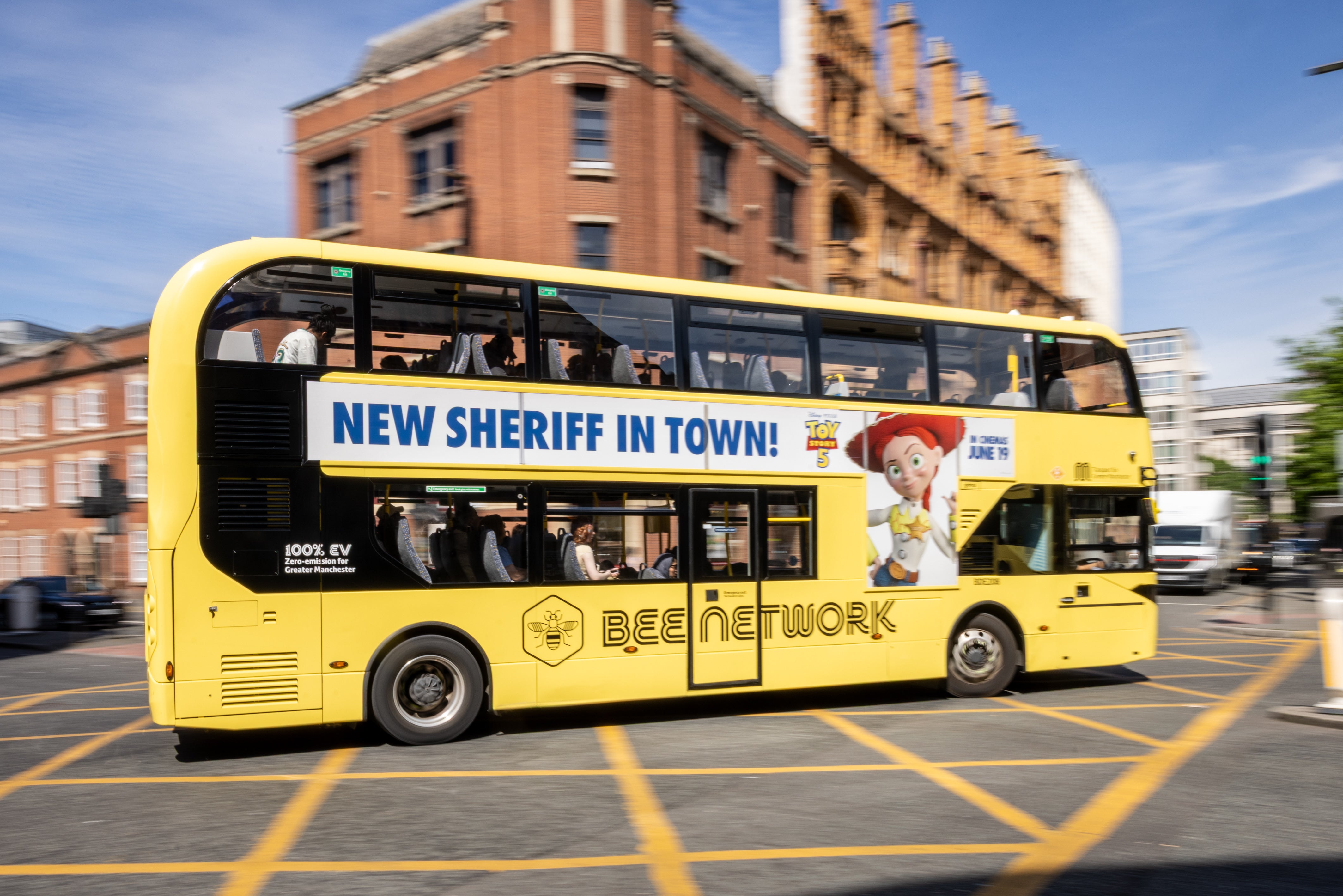 A Bee Network bus in Manchester city centre - bringing buses into public control was a flagship Burnham policy