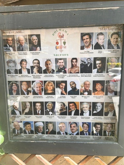 A board shows a list of celebrity guests at Dolmama restaurant