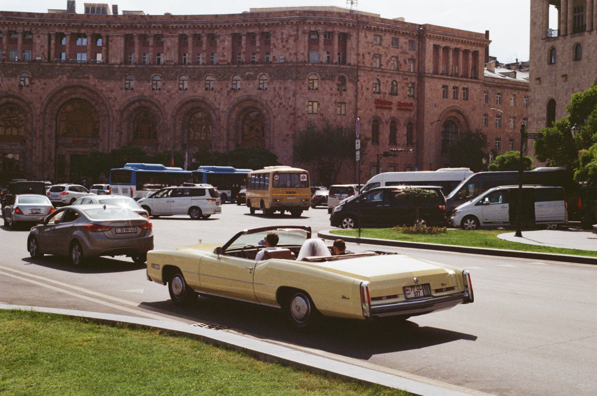 Cars drive through Republic Square in Yerevan