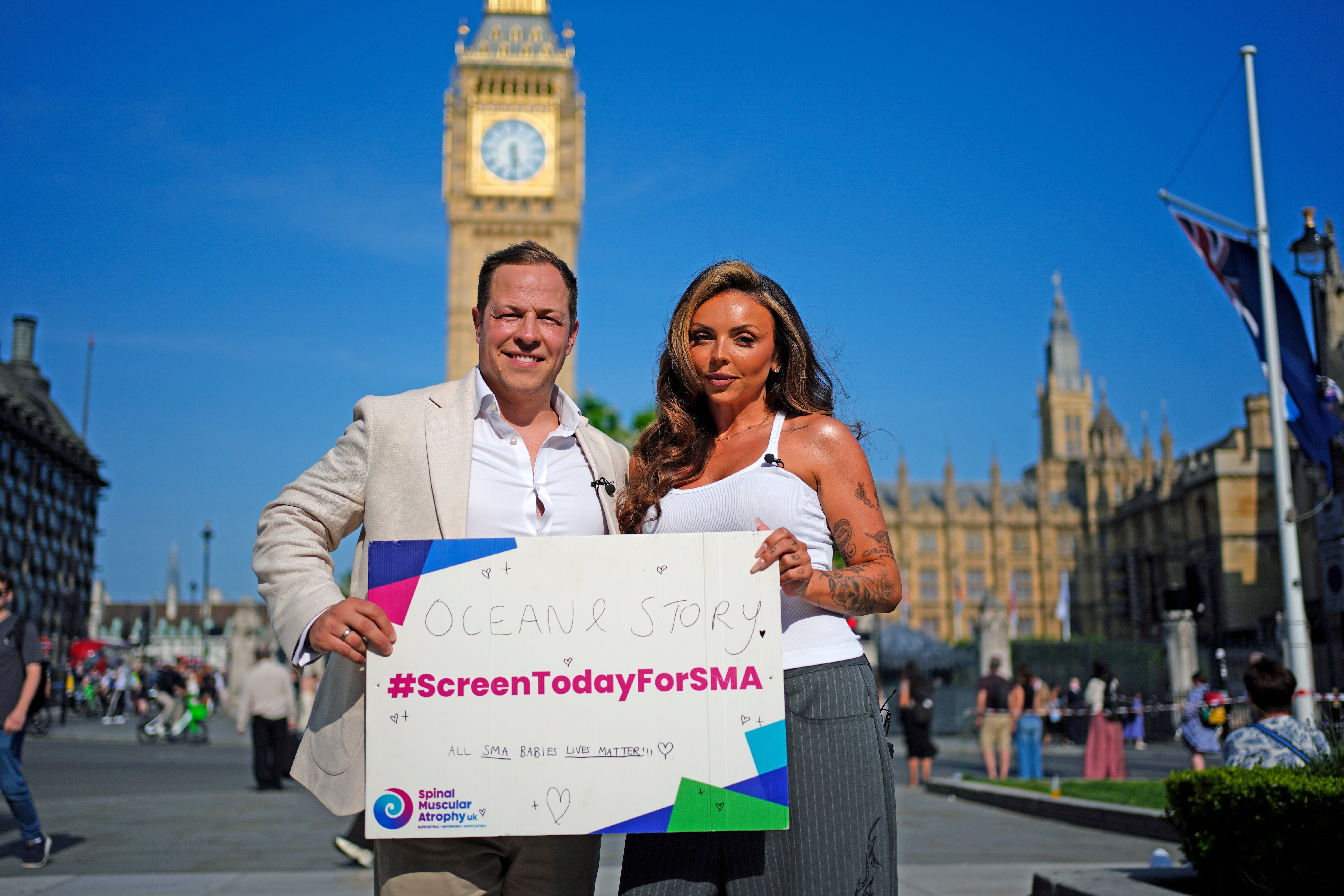 Giles Lomax, CEO for SMA UK and former Little Mix singer Jesy Nelson in Parliament Square, London, ahead of the SMA screening debate at Westminster Hall (PA)