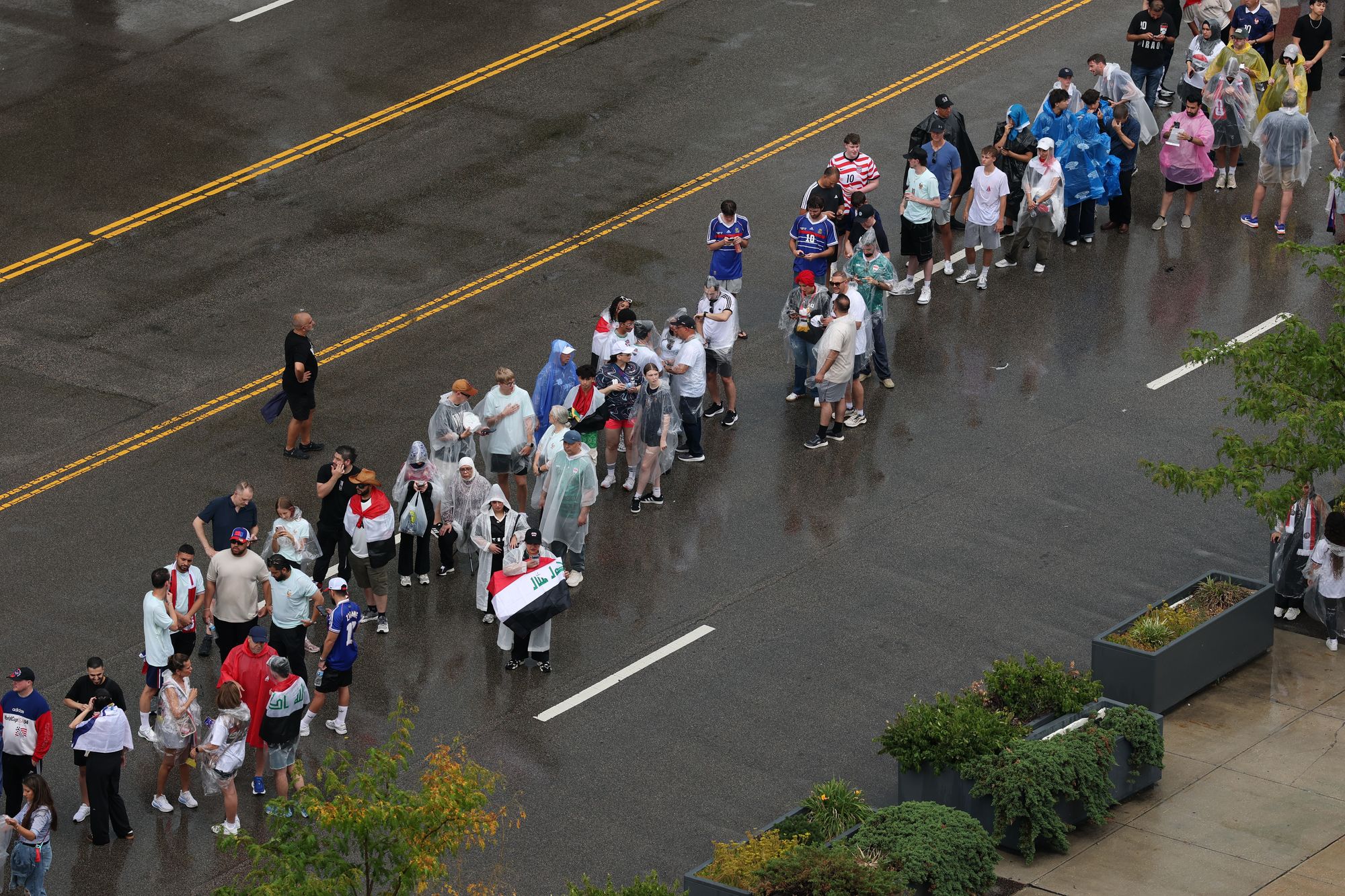 Fans are seen in the rain before the FIFA World Cup 2026 Group I match between France and Iraq at Philadelphia Stadium on June 22, 2026