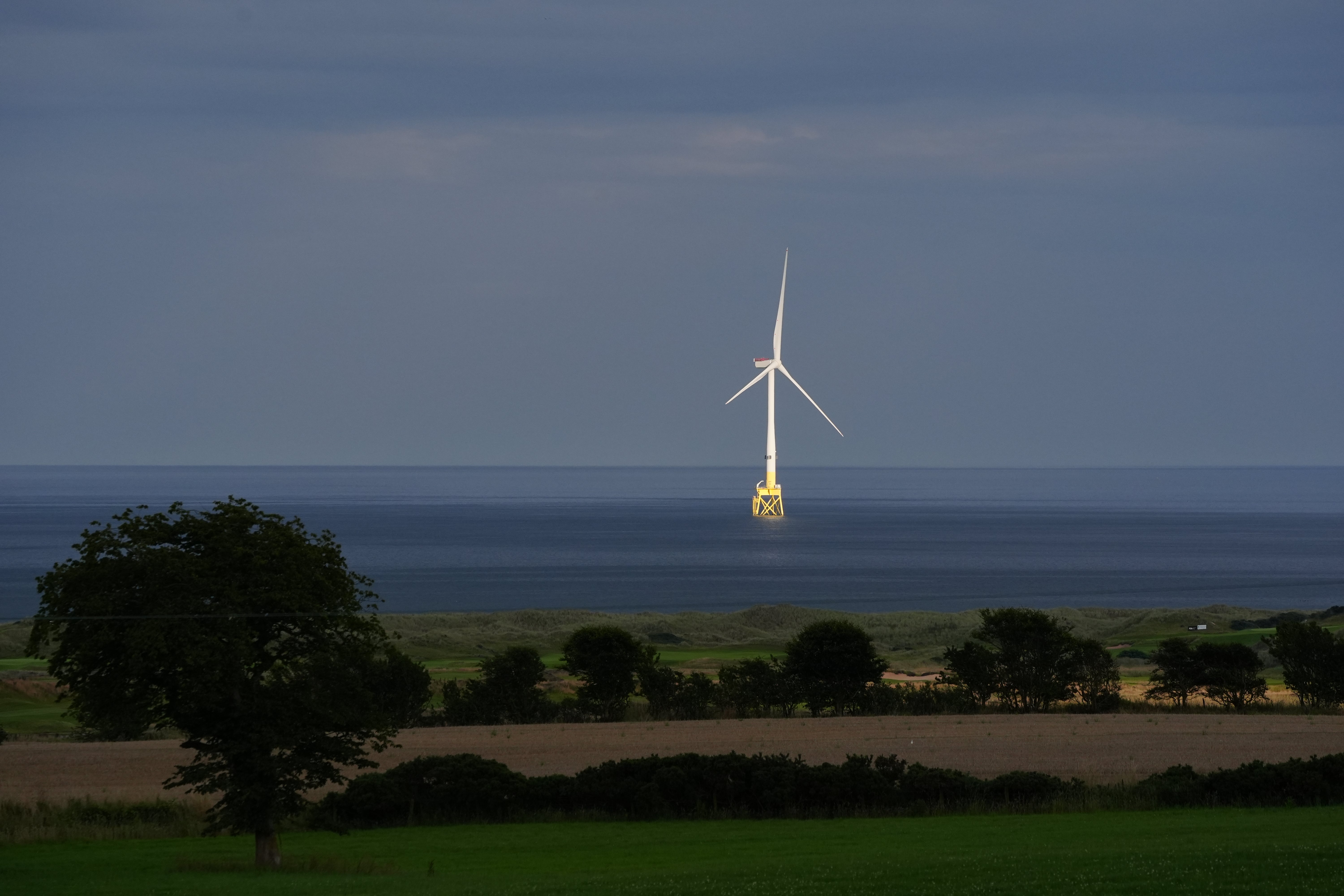 Britain gets electricity from different sources, including wind turbines (Jane Barlow/PA)
