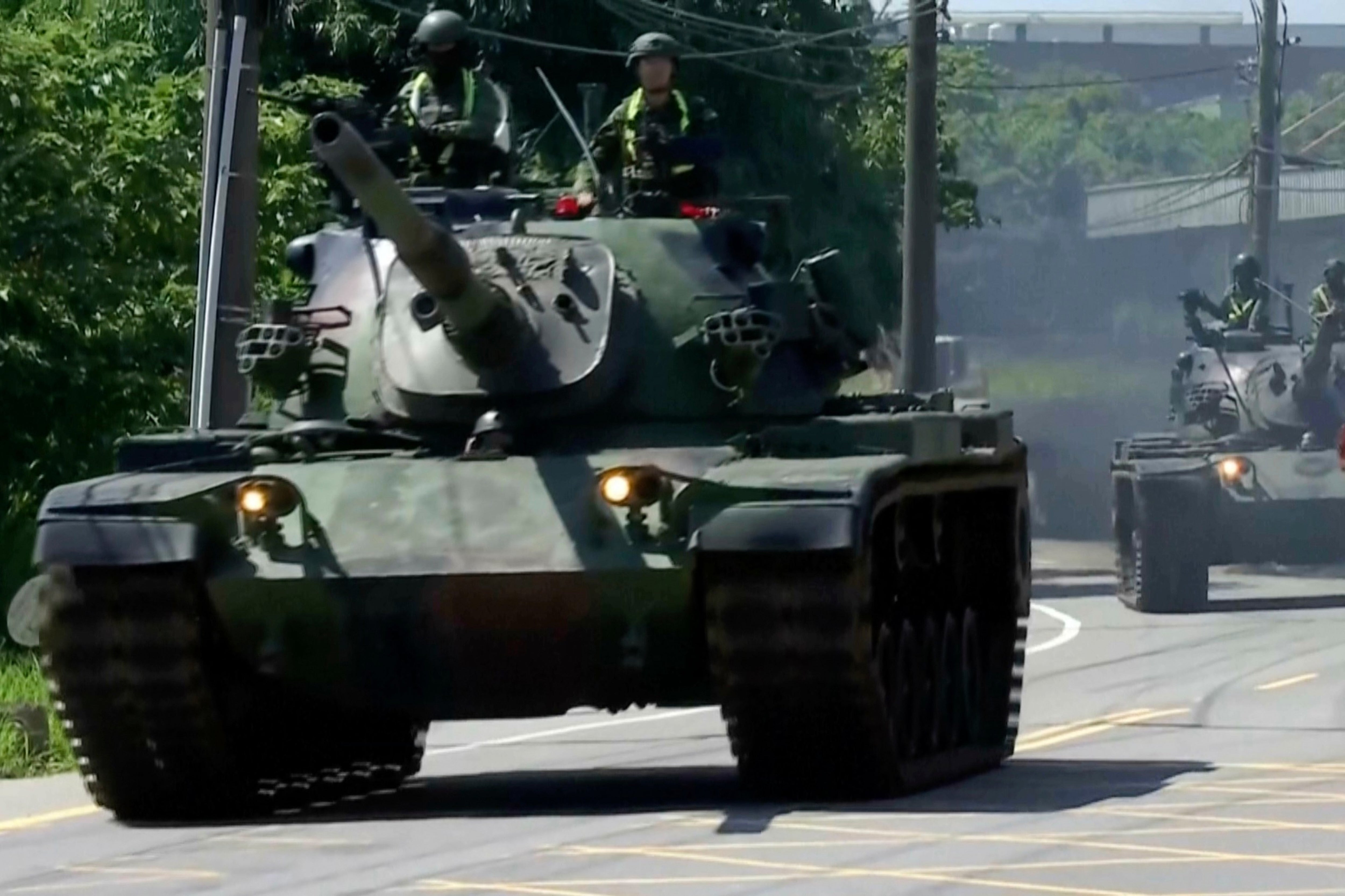Tanks patrol a street during combat readiness exercises in Taoyuan, Taiwan, on 22 June 2026