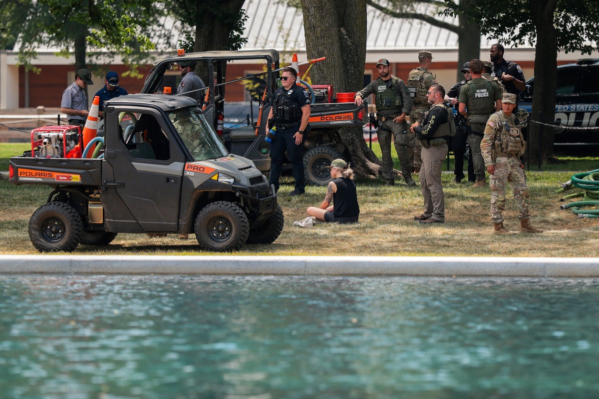 National Guard and Park Police patrol Reflecting Pool after liner damage