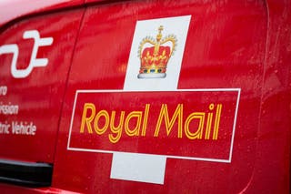 Royal Mail owner International Distribution Services said its UK postal arm grew revenues and earnings despite soaring staff costs after the Government’s job tax hike (James Manning/PA)