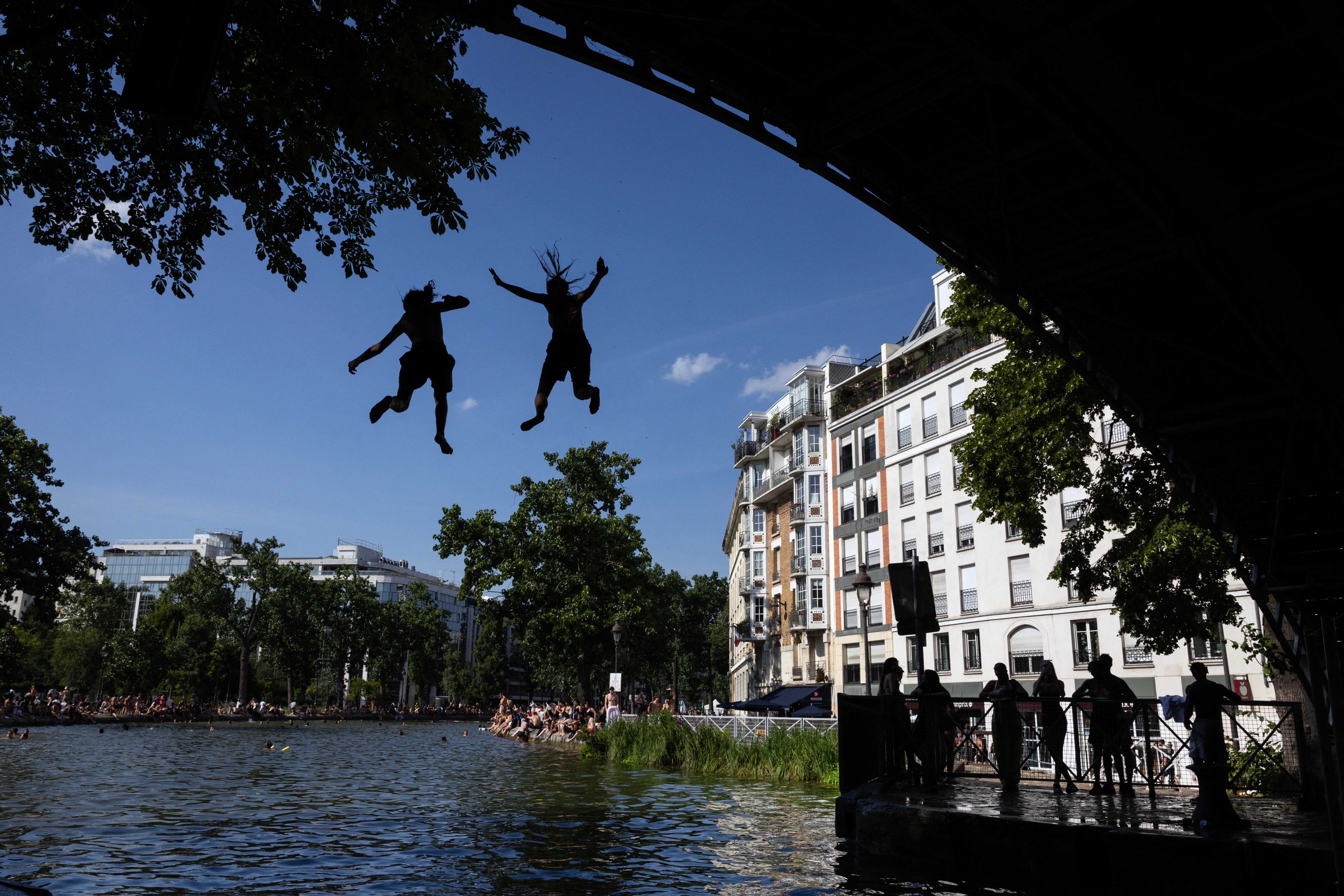 People have been urged to avoid swimming unsupervised as the heatwave sweeps France