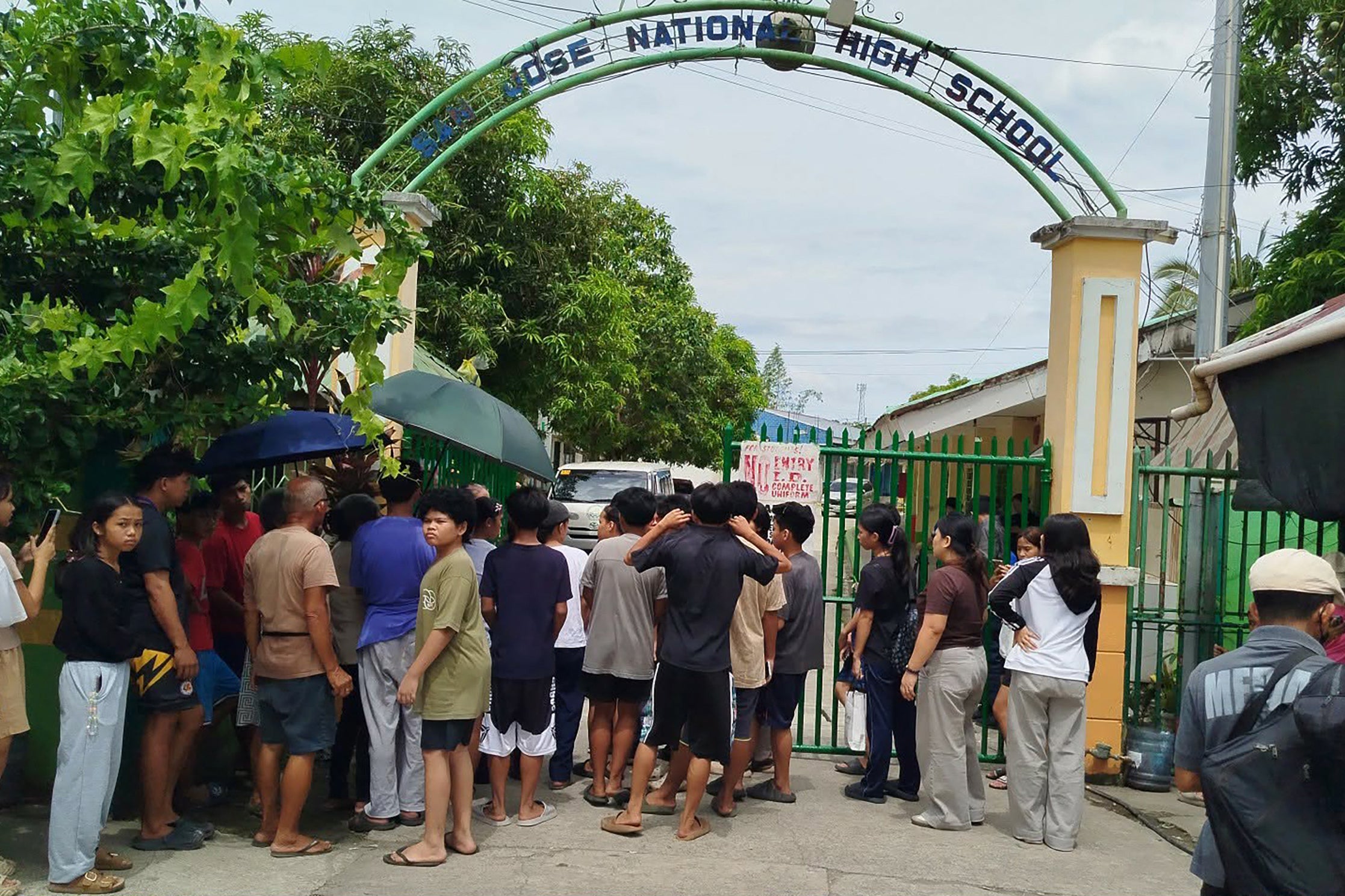 Three students were killed and 20 others were wounded when two suspects, ages 14 and 15, opened fire Monday at the San Jose National High School in central Tacloban city