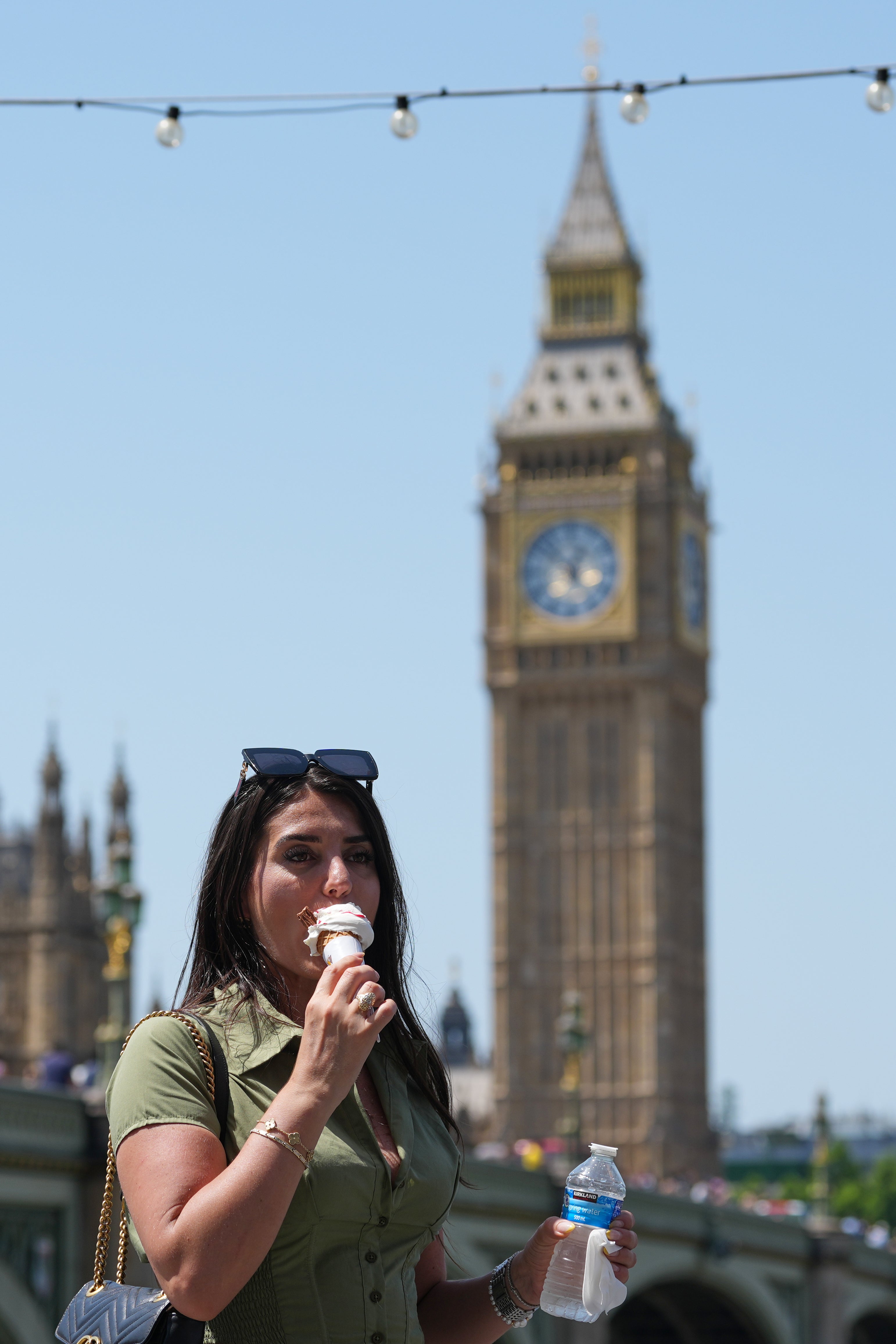 Britons stock up on fans and silk scarves as heat grips country