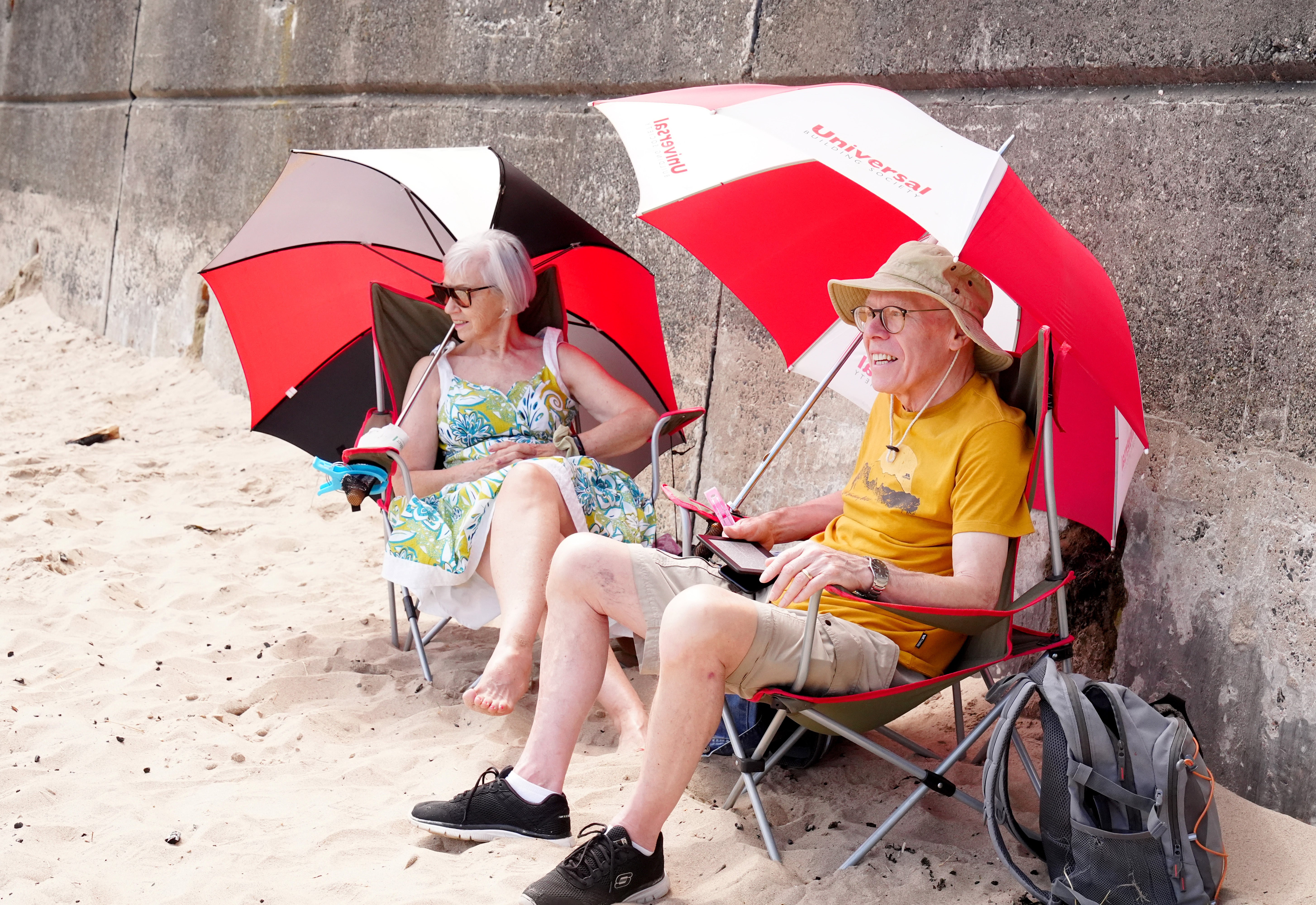 People sheltering from the sun at King Edward’s Bay, Tynemouth (Owen Humphreys/PA) (PA Wire)