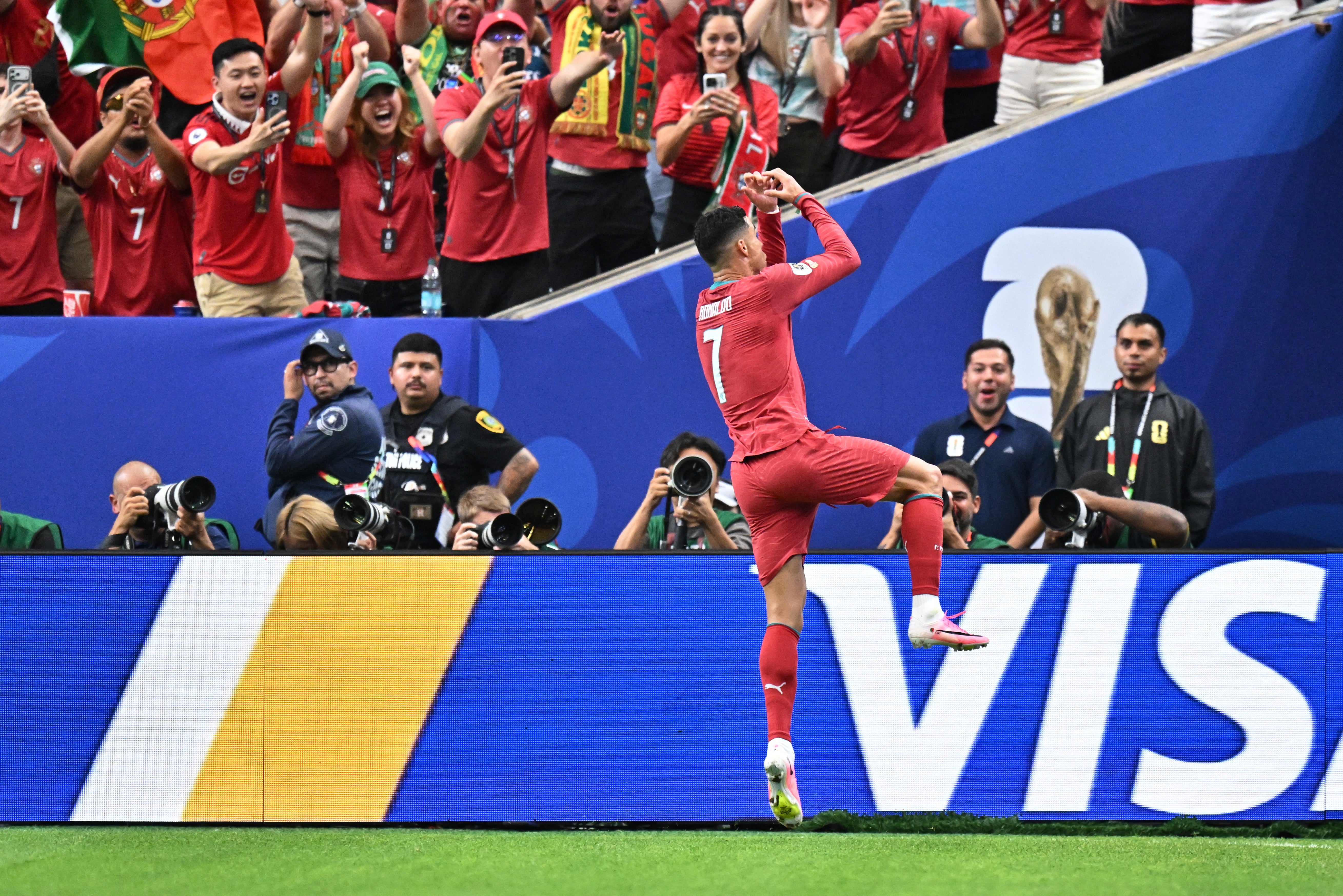 Ronaldo performs his customary celebration as Portugal fans look on (Reuters)