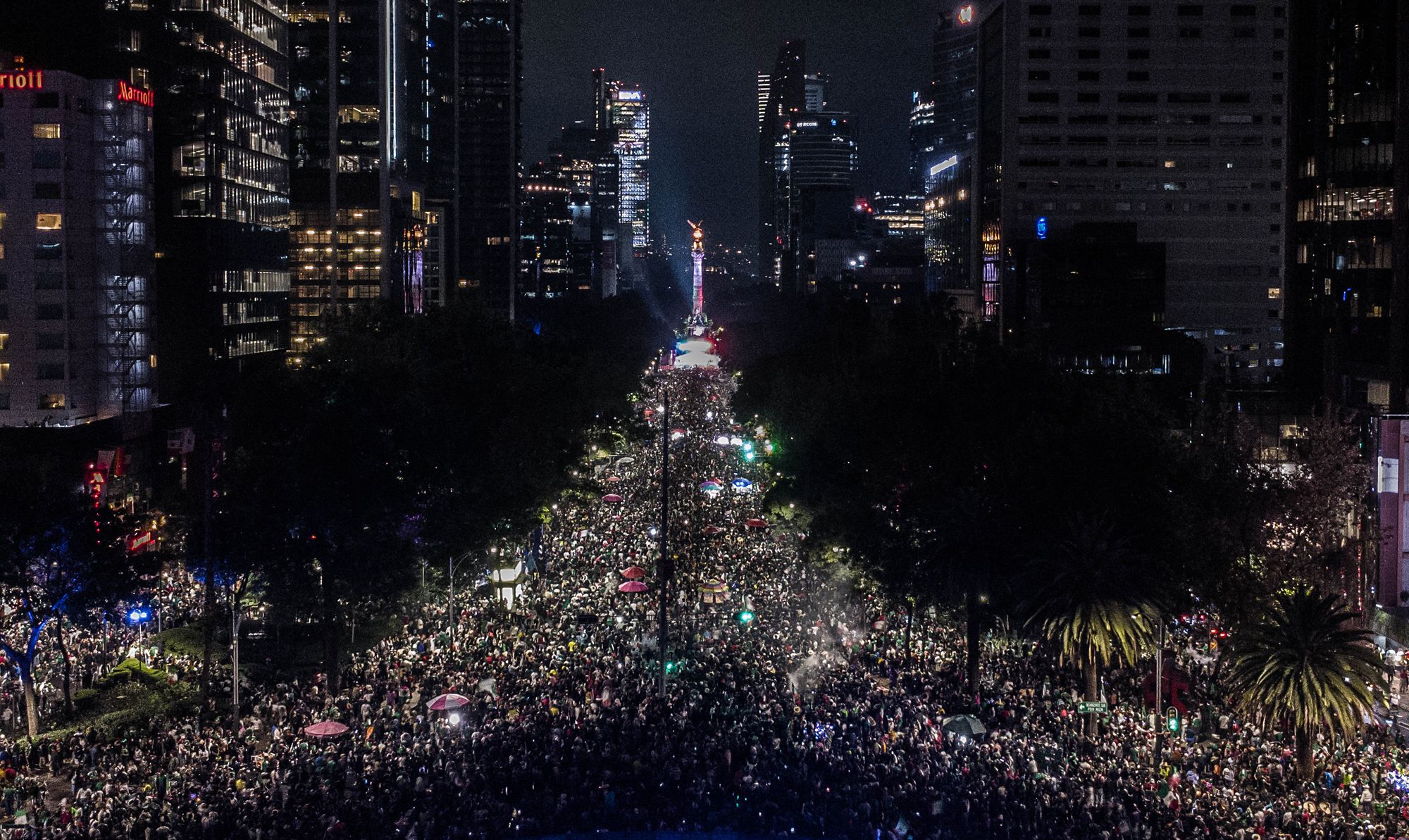 An aerial view of Mexican fans gathering at the Angel of Independence during the celebrations after Mexico's victory against Korea Republic