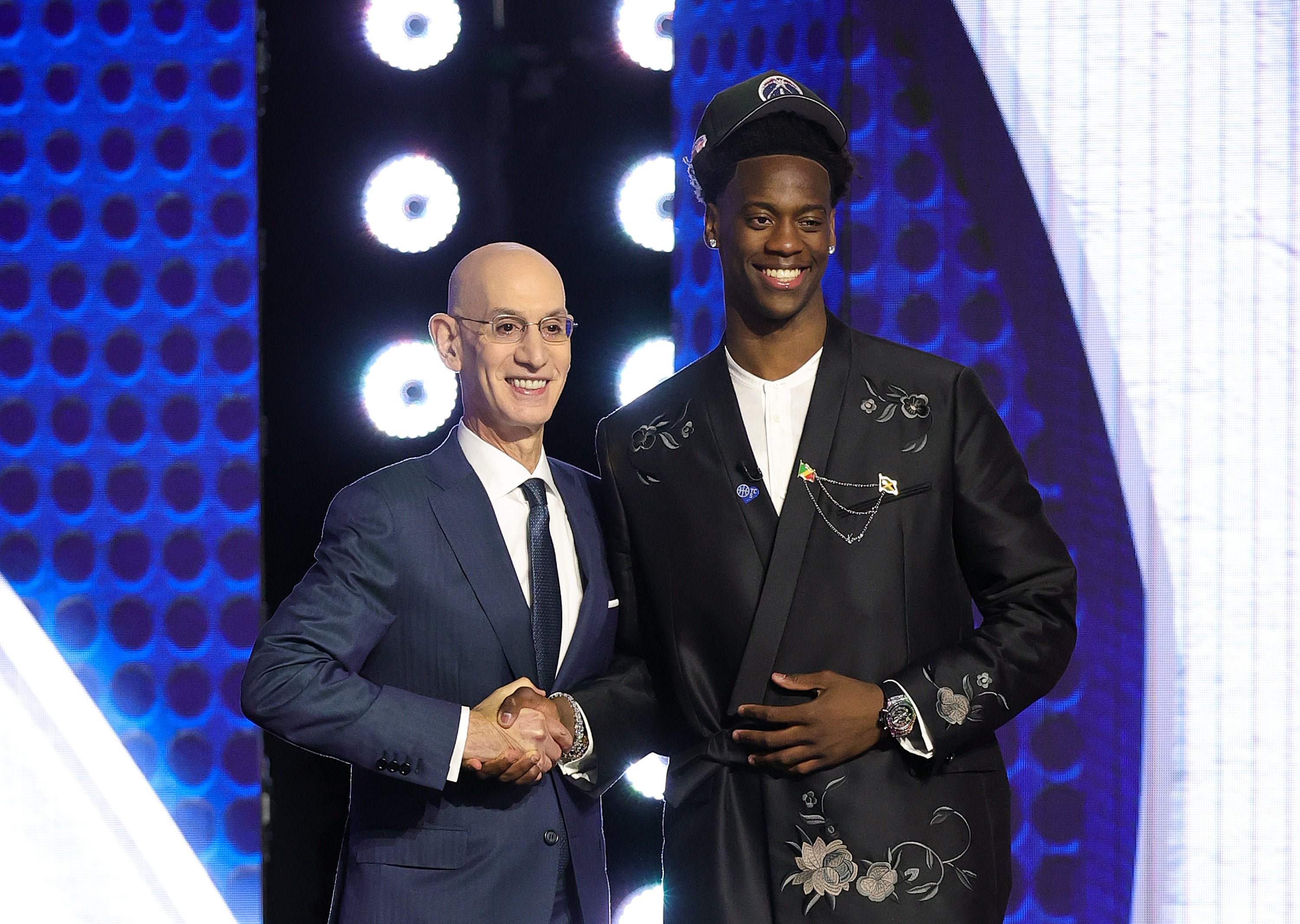 Dybantsa appeared to say a quick prayer after his name was announced, then went on stage to greet Commissioner Adam Silver and slipped on a black Wizards hat that matched nicely with his black suit