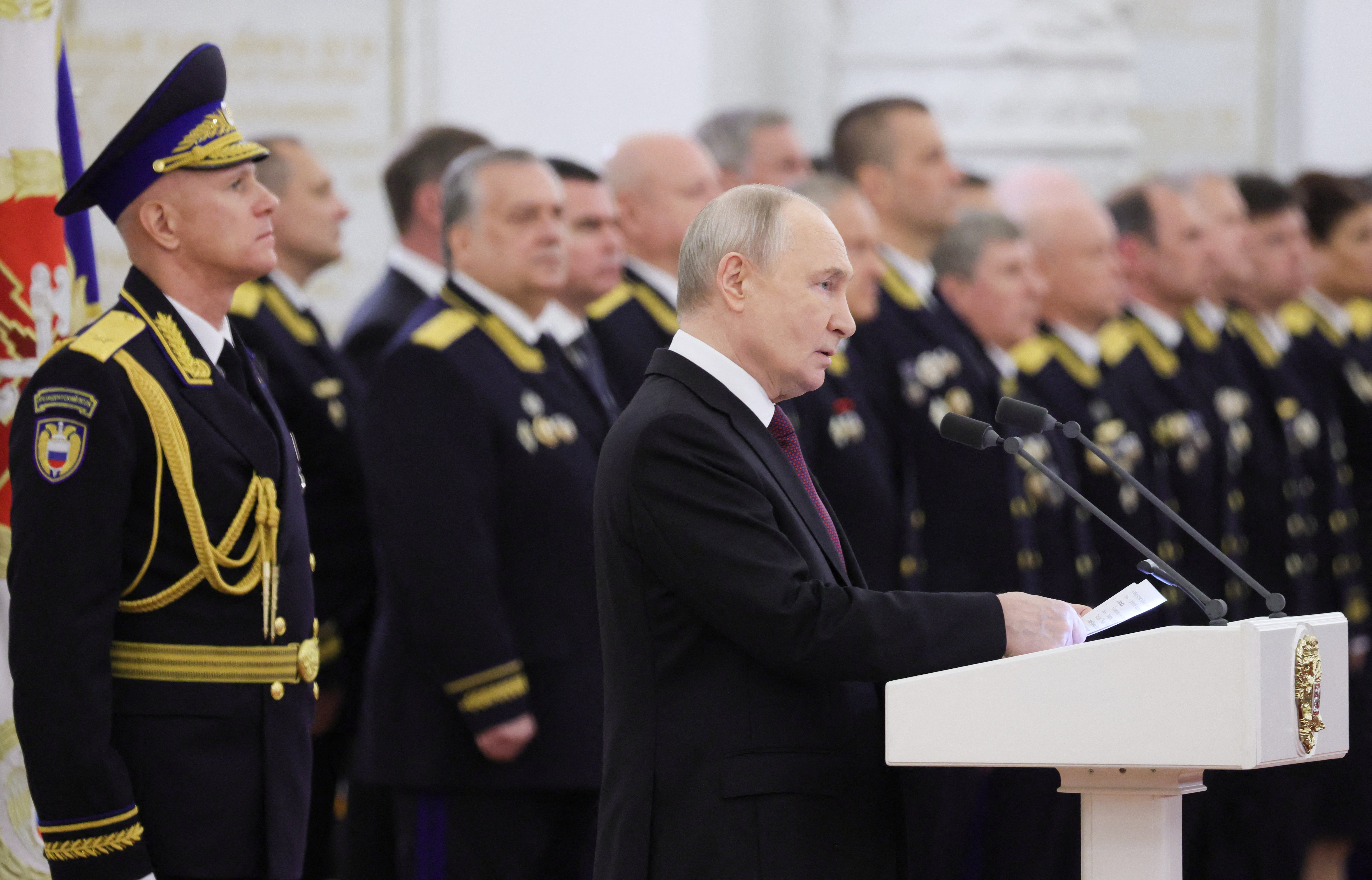 Russia's president Vladimir Putin hosts a ceremony to award the presidential regiment of the federal guard service with the Order of Zhukov at the Kremlin in Moscow (AFP/Getty)