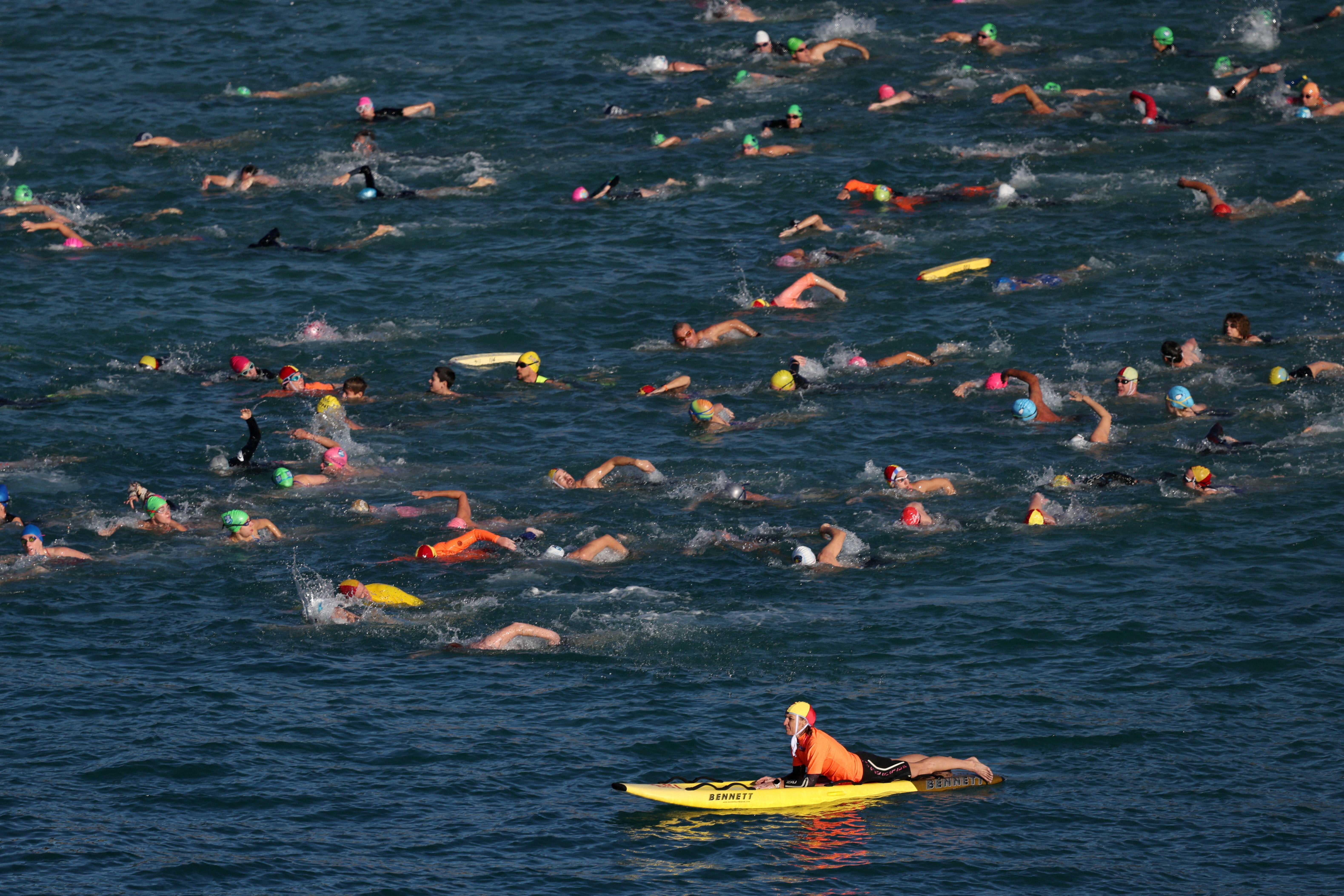 People take part in a community swim hosted by Coogee Beach Surf Life Saving Club and Randwick City Council to show support for Sydney mother Leah Stewart on 21 June 2026 (Reuters)
