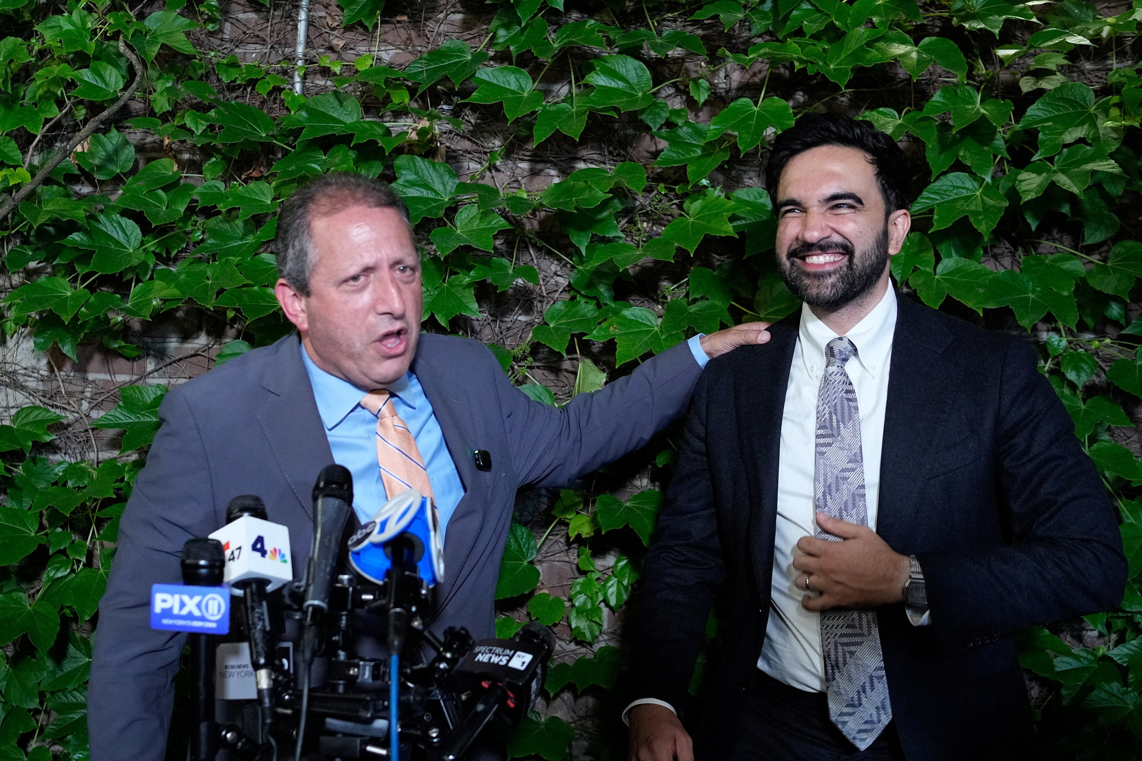 Brad Lander, who beat incumbent Rep. Dan Goldman in New York’s 10th Congressional District, speaks to the media while standing next to New York City Mayor Zohran Mamdani