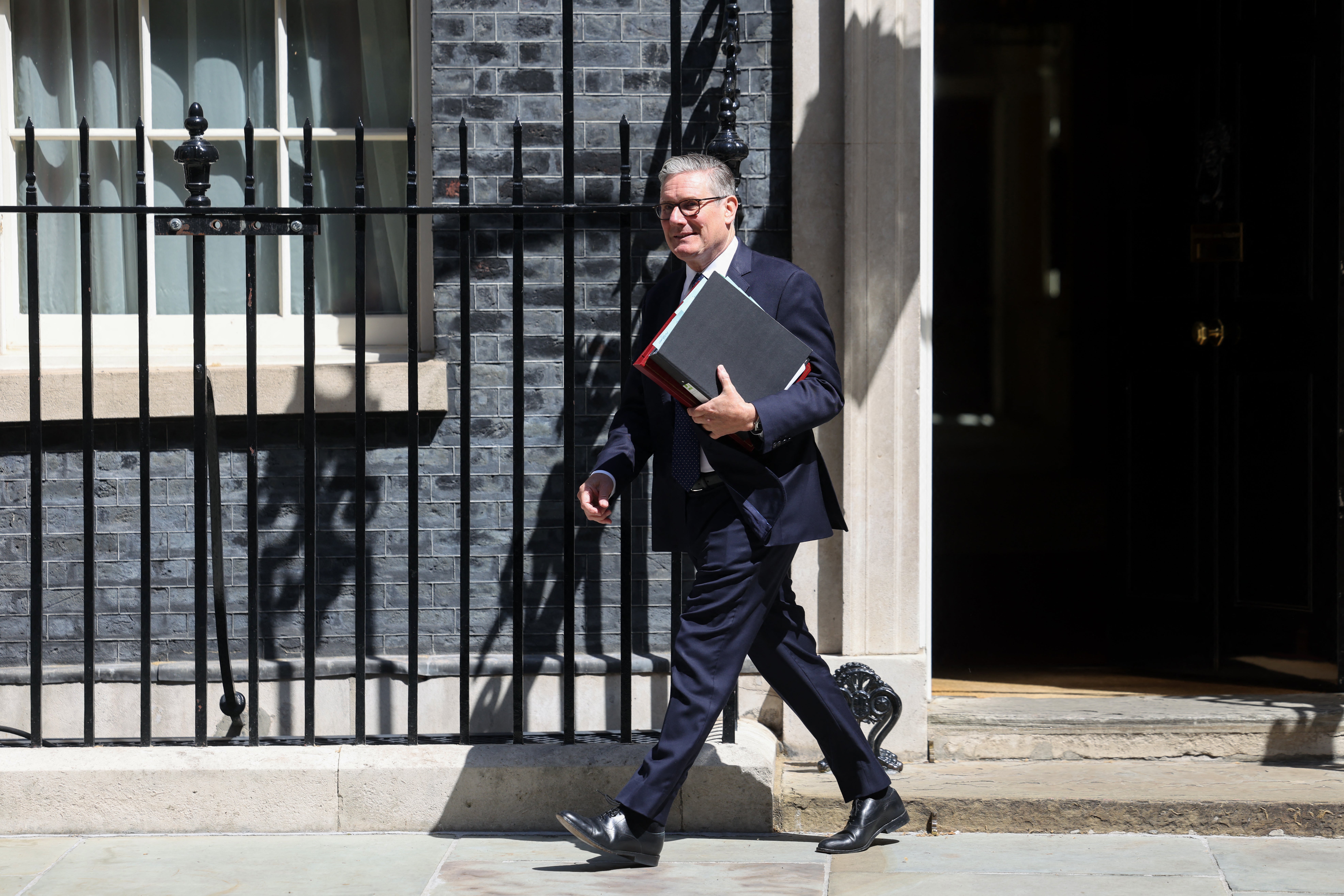 Keir Starmer leaves 10 Downing Street for PMQs (AFP/Getty)