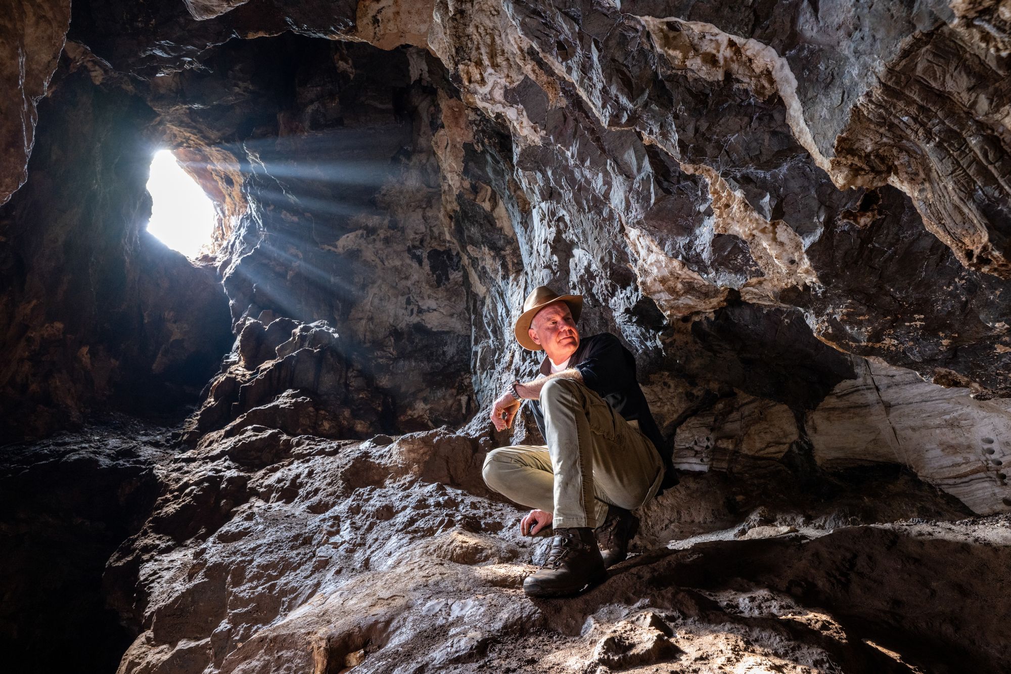 National Geographic Explorer in Residence and paleoanthropologist Lee Berger in an entrance chamber of Rising Star Cave in South Africa.