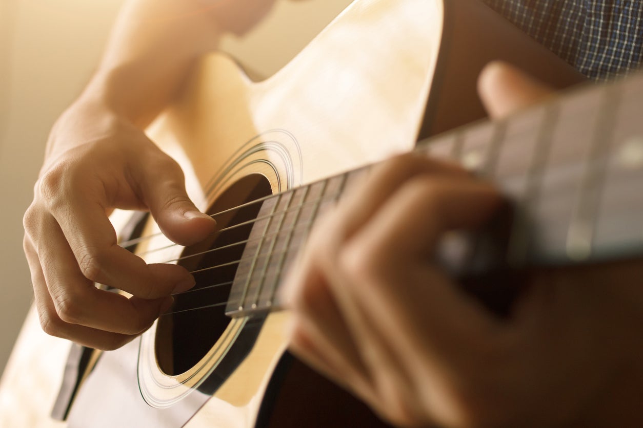 Doing something fiddly and new with your fingers, such as learning new chords on a guitar, takes real concentration